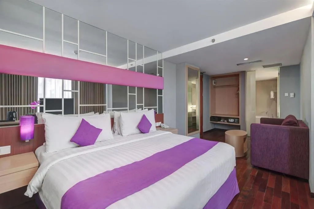 Bed in Quest Hotel Darmo - Surabaya by ASTON