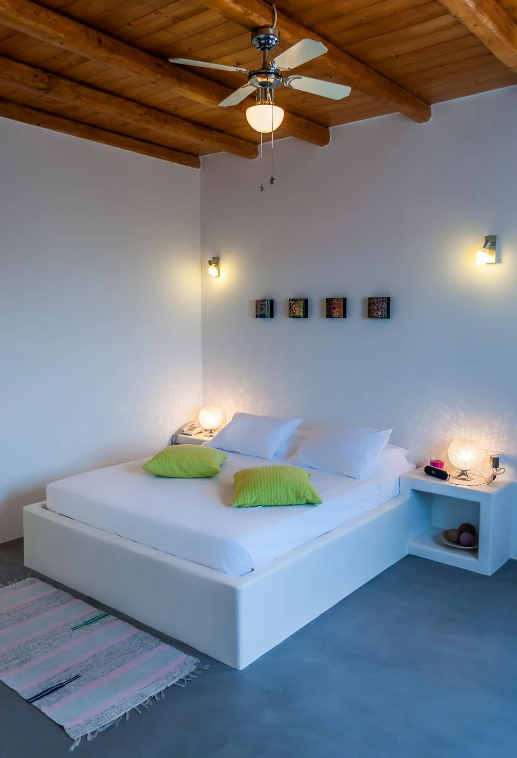 Bed in Eiriana Luxury Suites