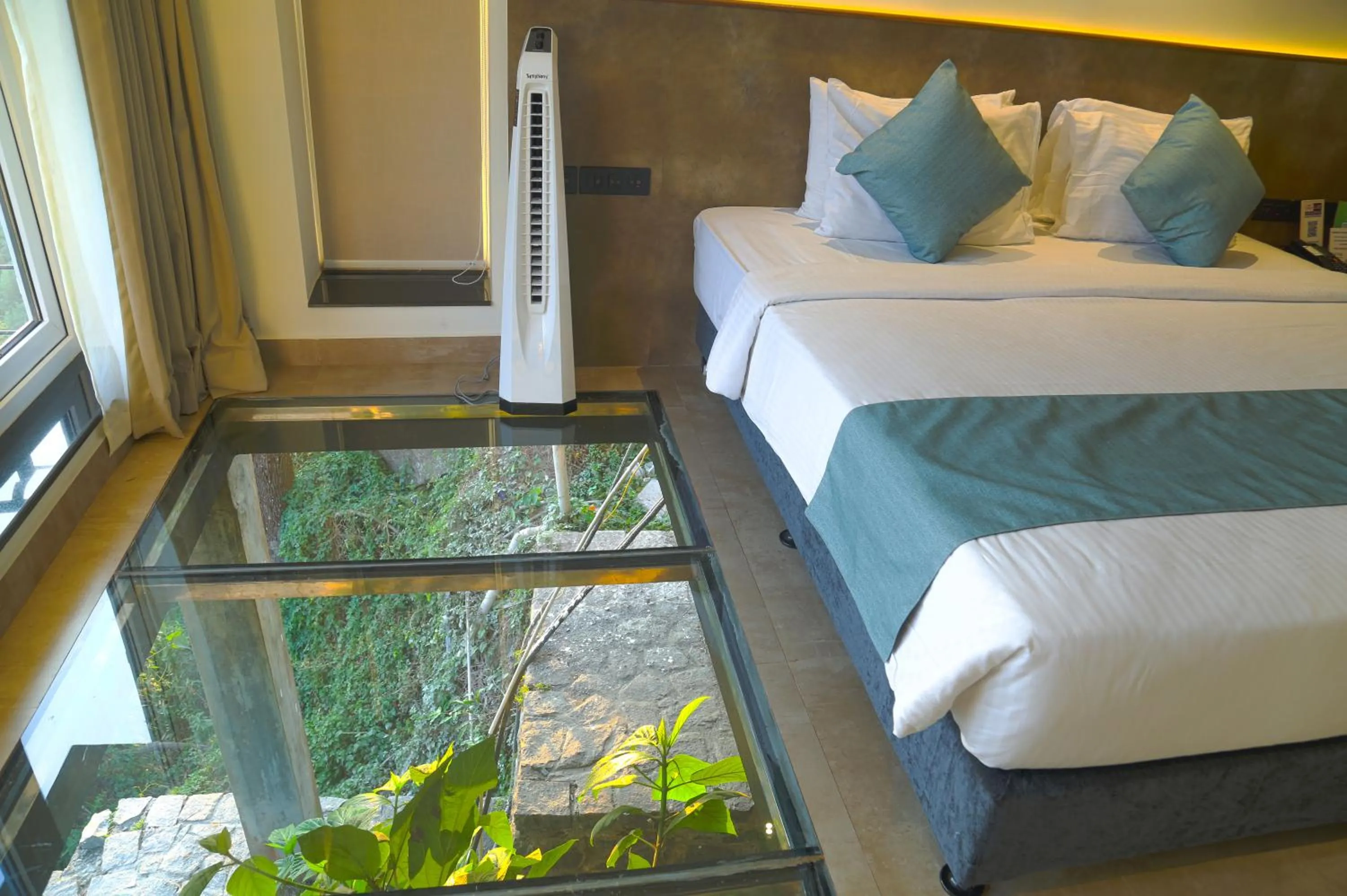 Bed in GReaT Trails Yercaud by GRT Hotels