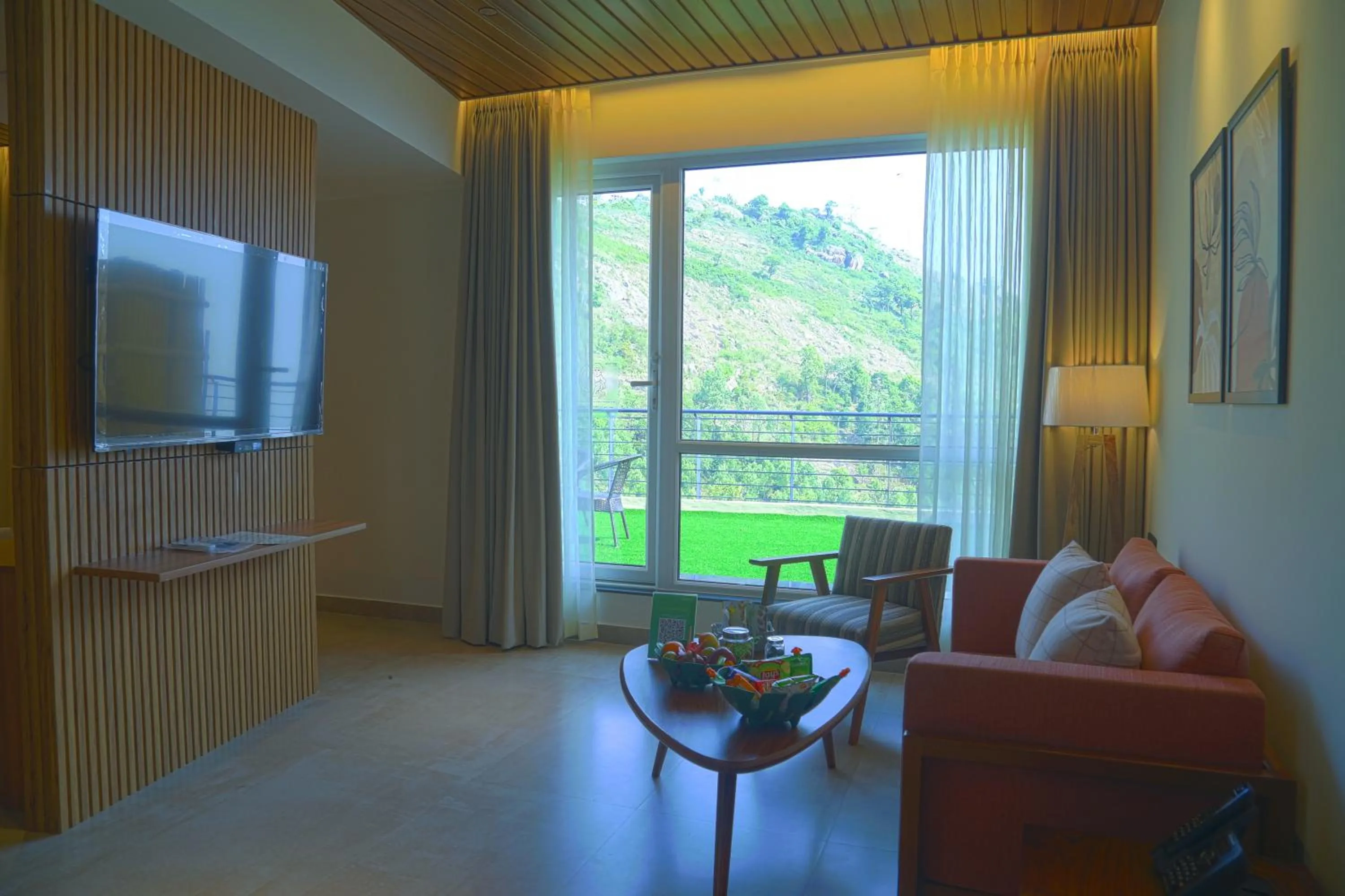 Living room in GReaT Trails Yercaud by GRT Hotels