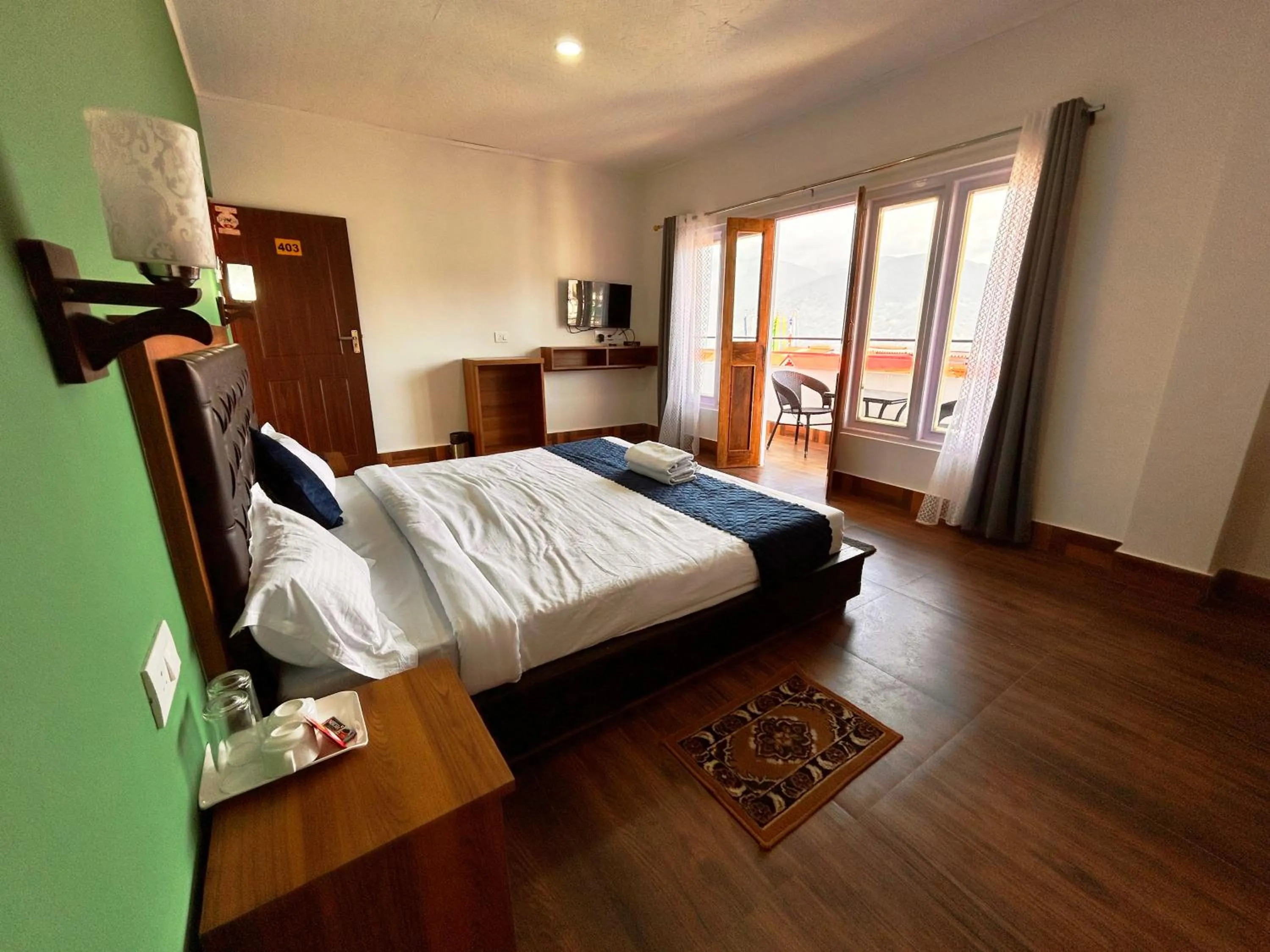 Living room, Bed in DISHA SILVER PEAK Hotel