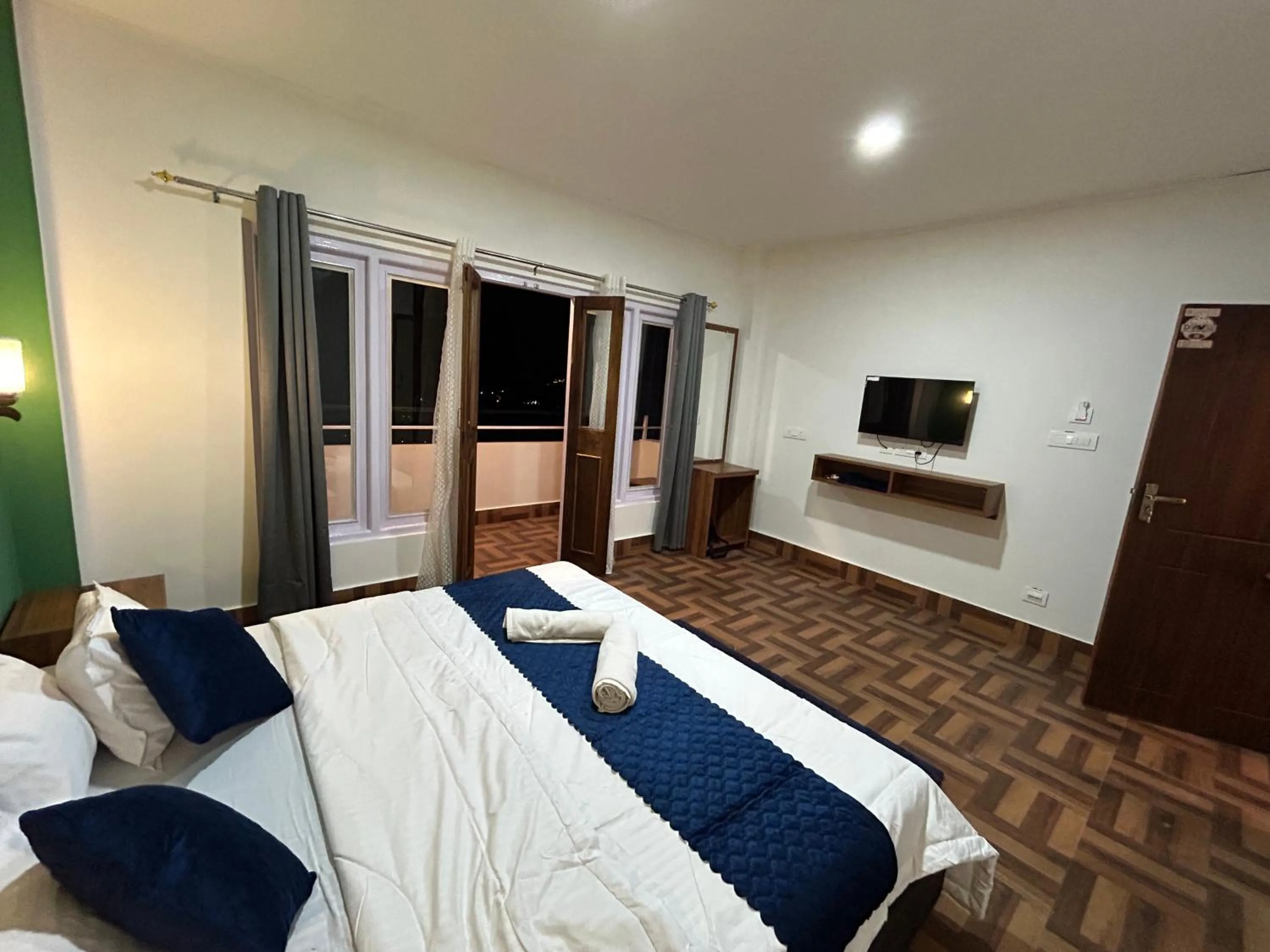 Photo of the whole room, Bed in DISHA SILVER PEAK Hotel