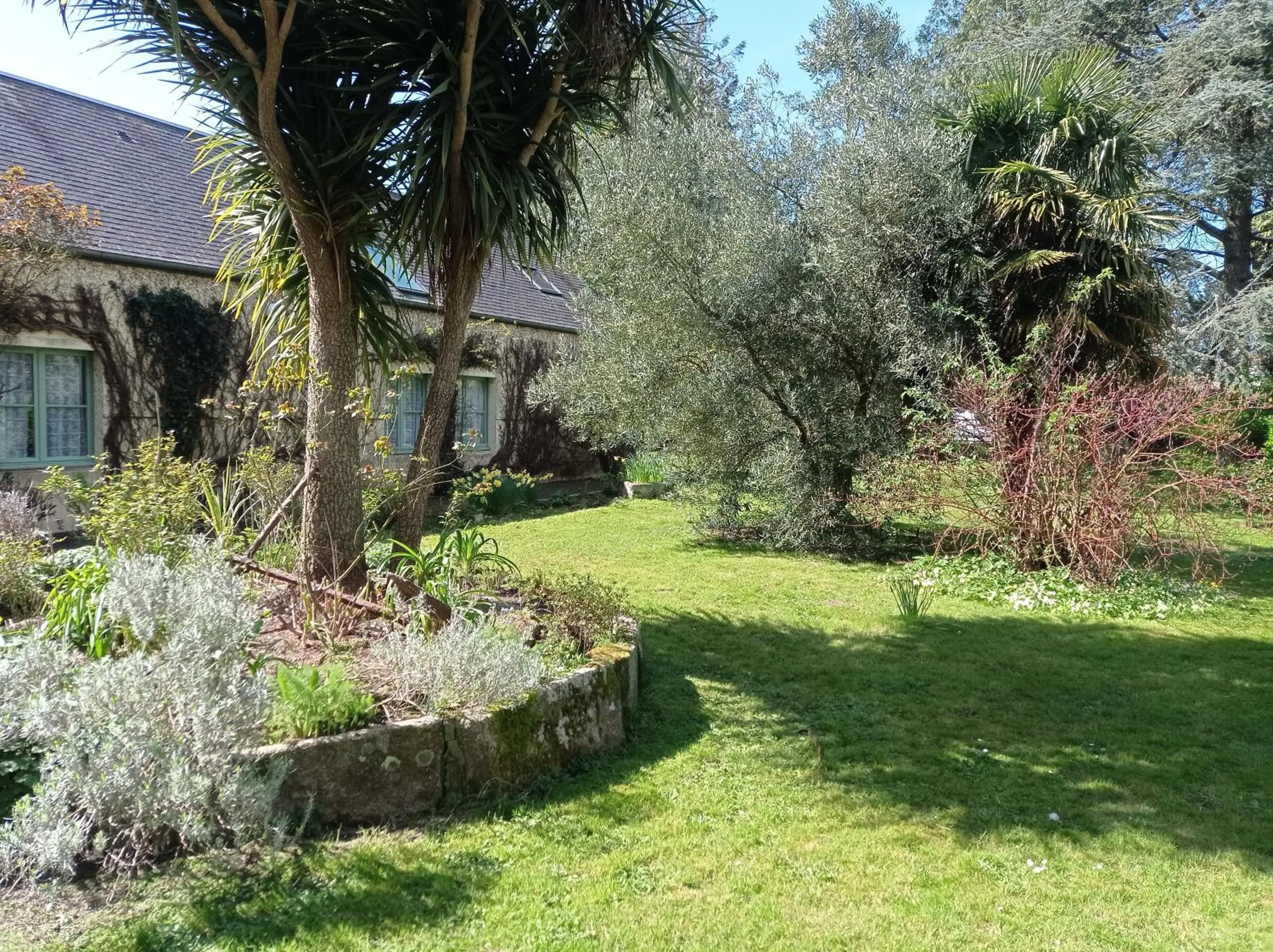 Garden in Logis Hôtel La Demeure du Perron