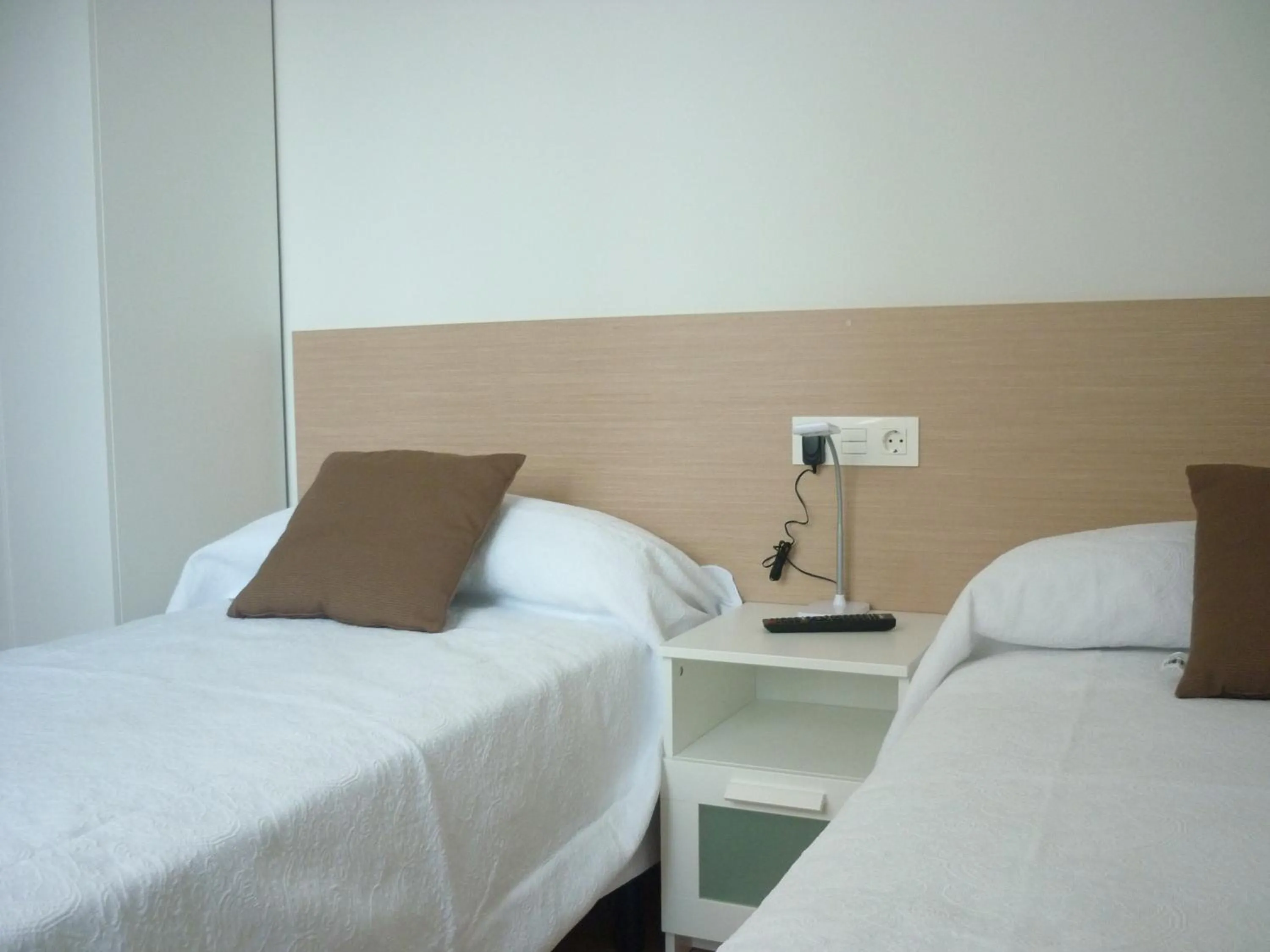 Decorative detail, Bed in Pensión-Albergue Puente Ribeira