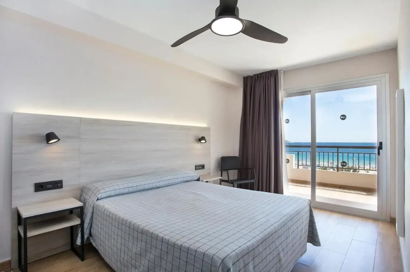 Bed in Apartamentos Odysea By Apartamentos Valentia Bed in Apartamentos Odysea By Apartamentos Valentia