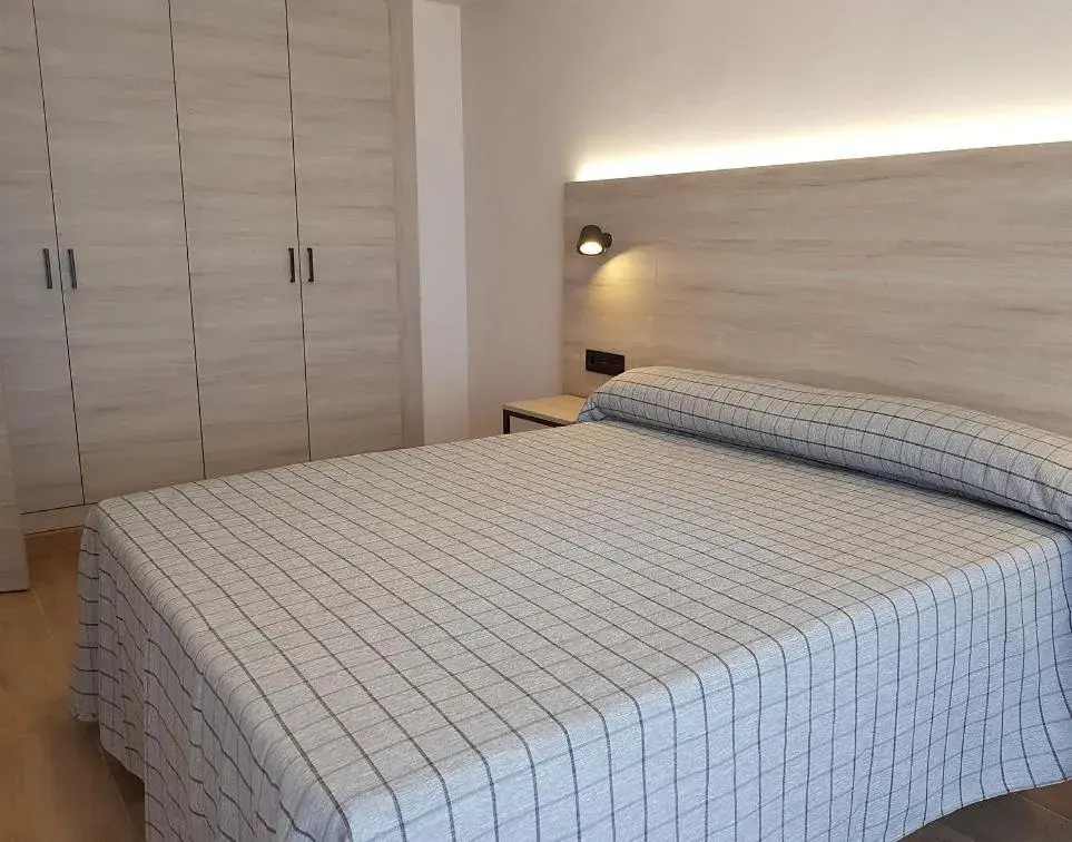 Bed in Apartamentos Odysea By Apartamentos Valentia Bed in Apartamentos Odysea By Apartamentos Valentia