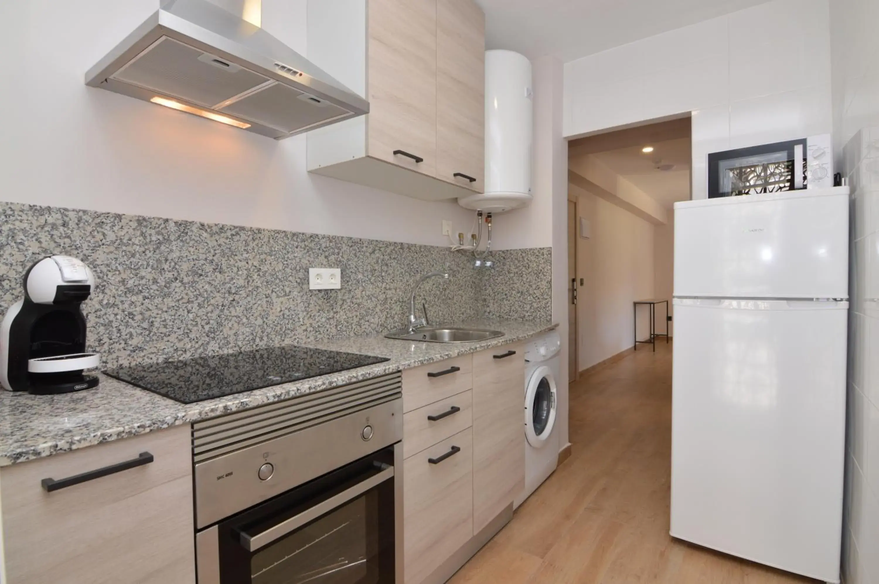 Kitchen or kitchenette in Apartamentos Odysea By Apartamentos Valentia Kitchen or kitchenette in Apartamentos Odysea By Apartamentos Valentia