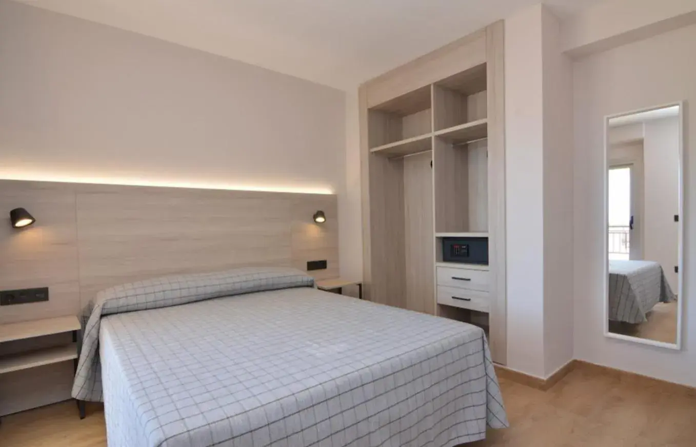 Bed in Apartamentos Odysea By Apartamentos Valentia Bed in Apartamentos Odysea By Apartamentos Valentia
