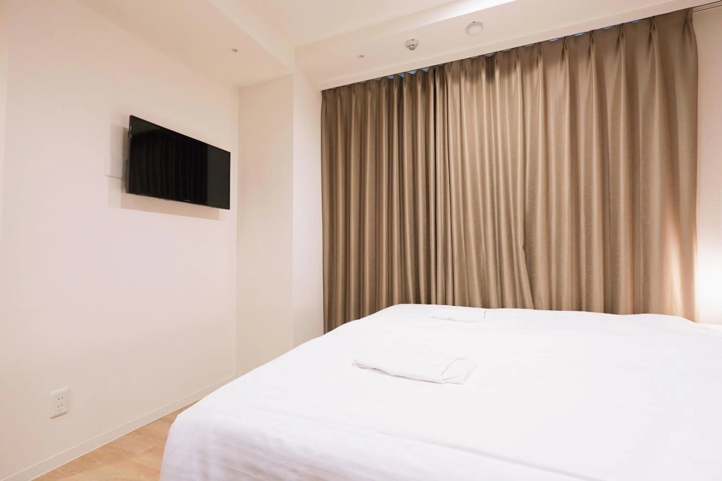 Bed in Park Central Sakura Hotel