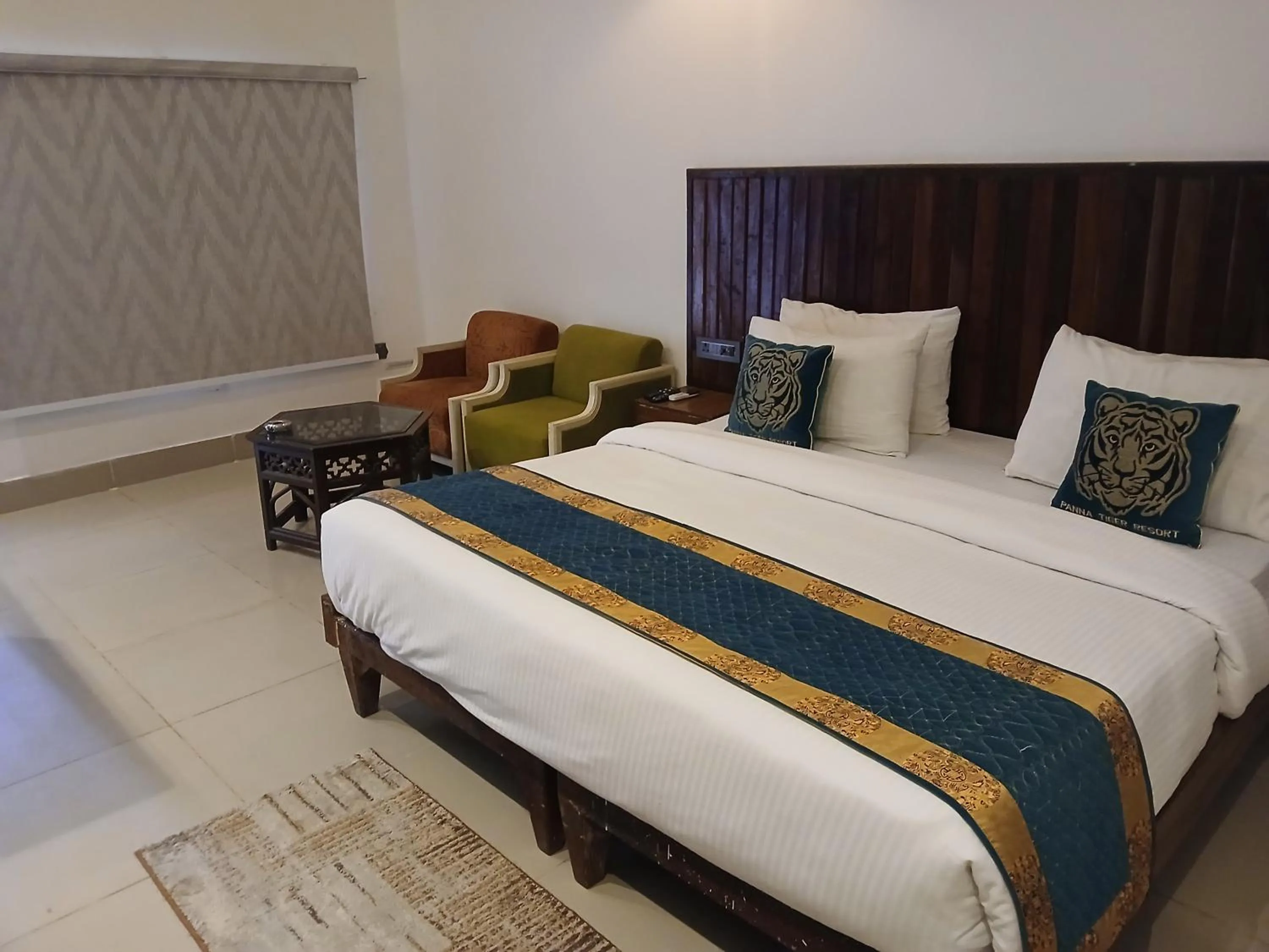 Living room, Bed in Panna Tiger Resort- Riverside Property