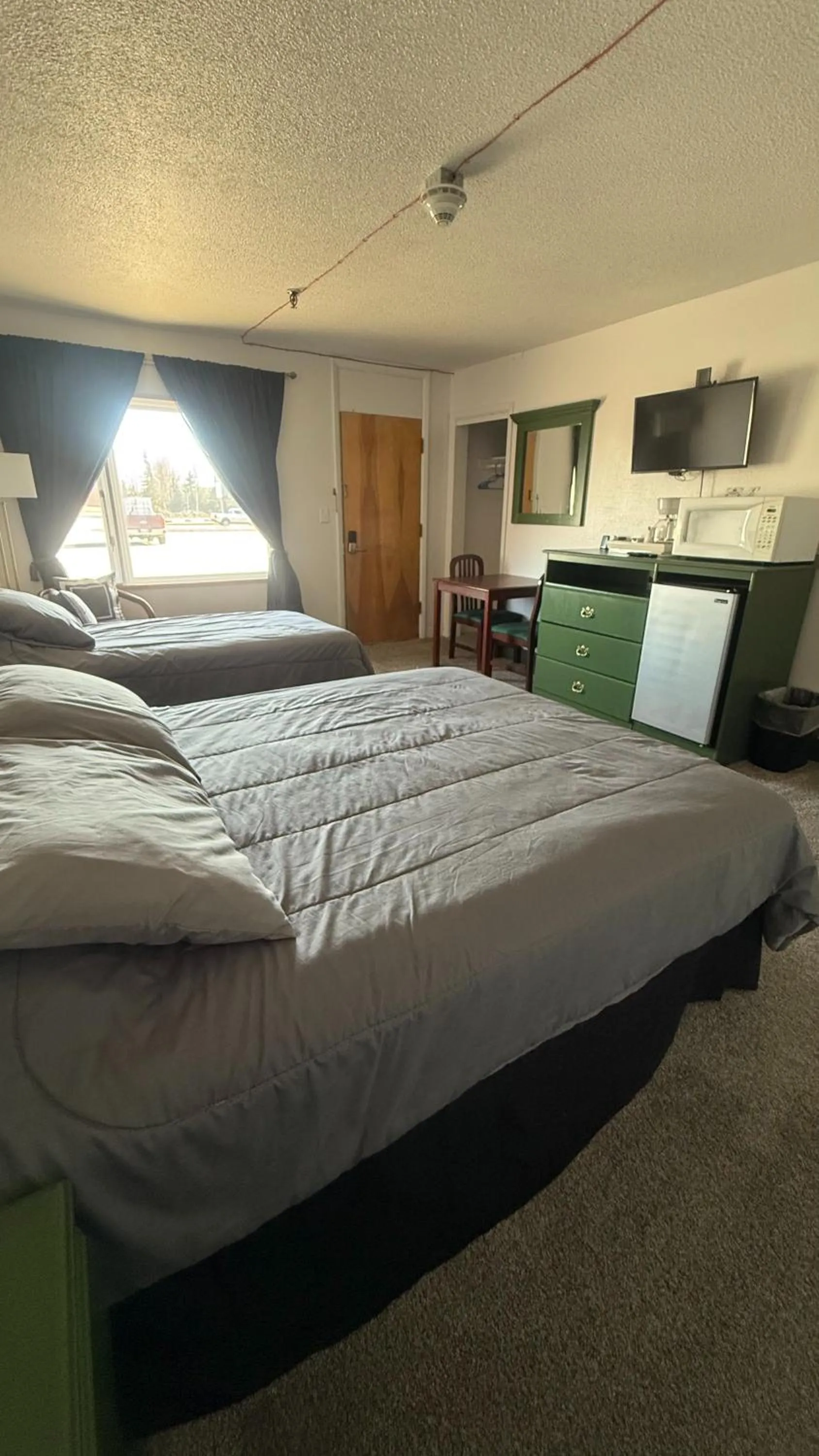 Bed in The Kenai Inn