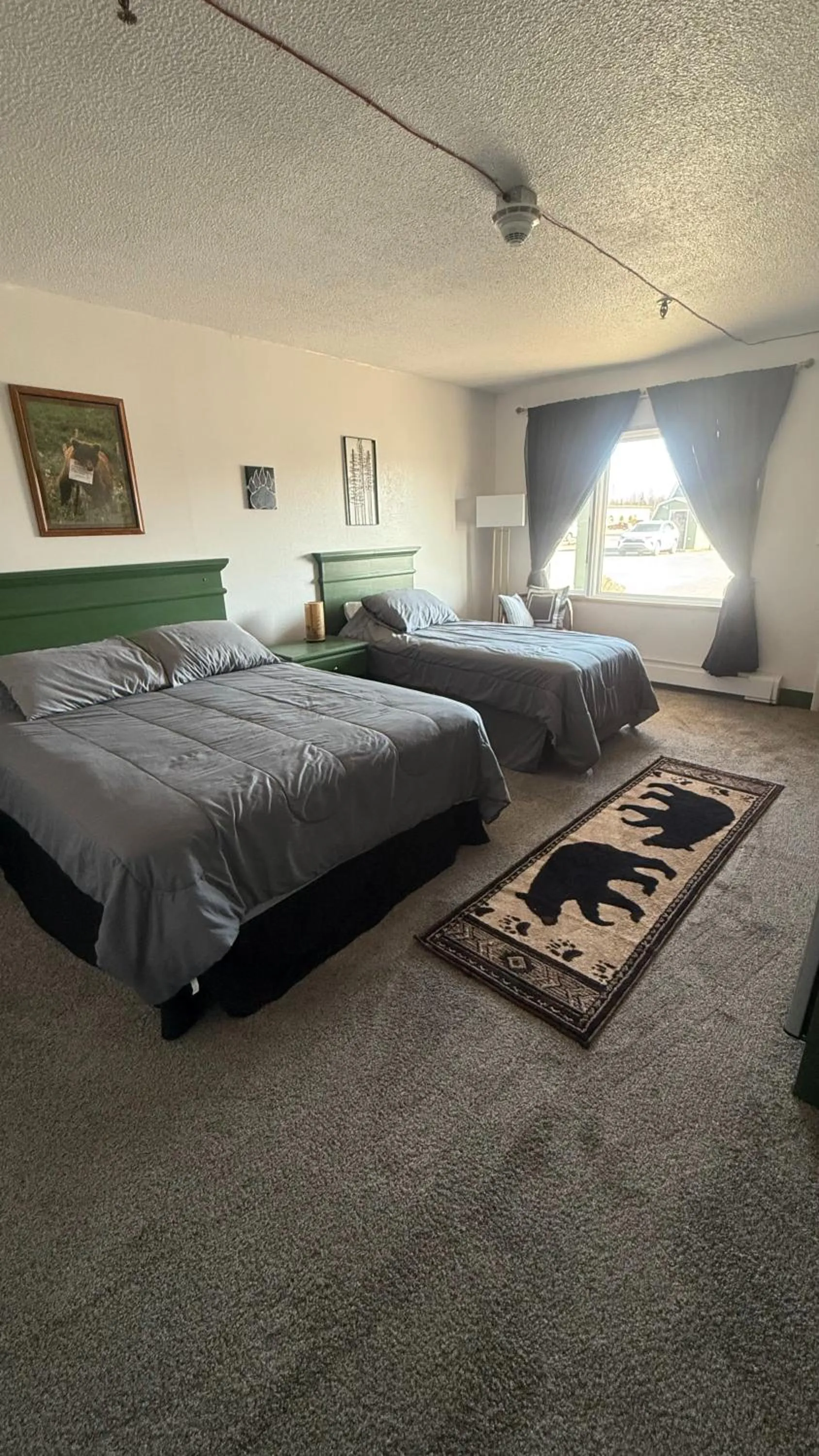 Bed in The Kenai Inn