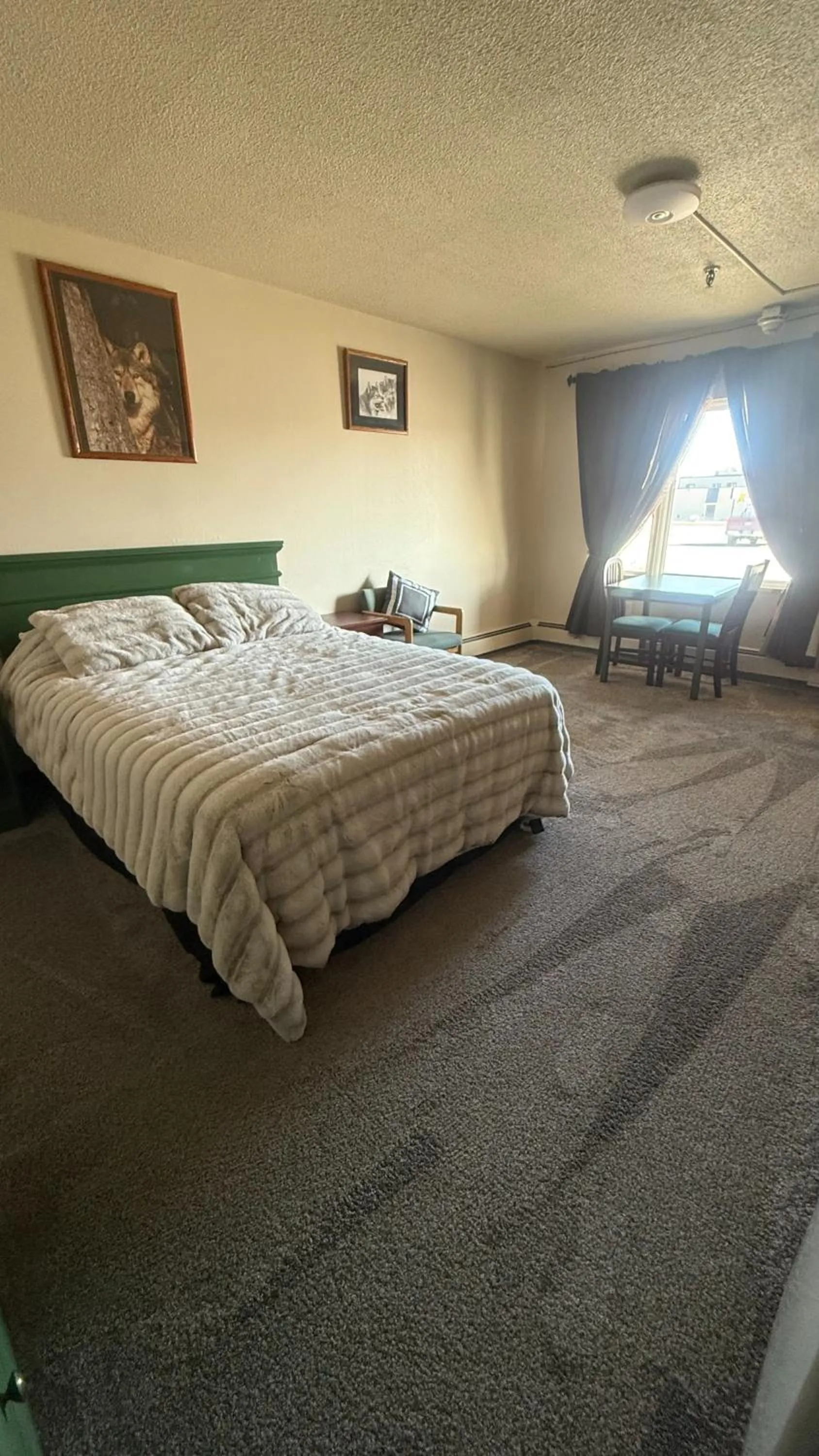 Bed in The Kenai Inn