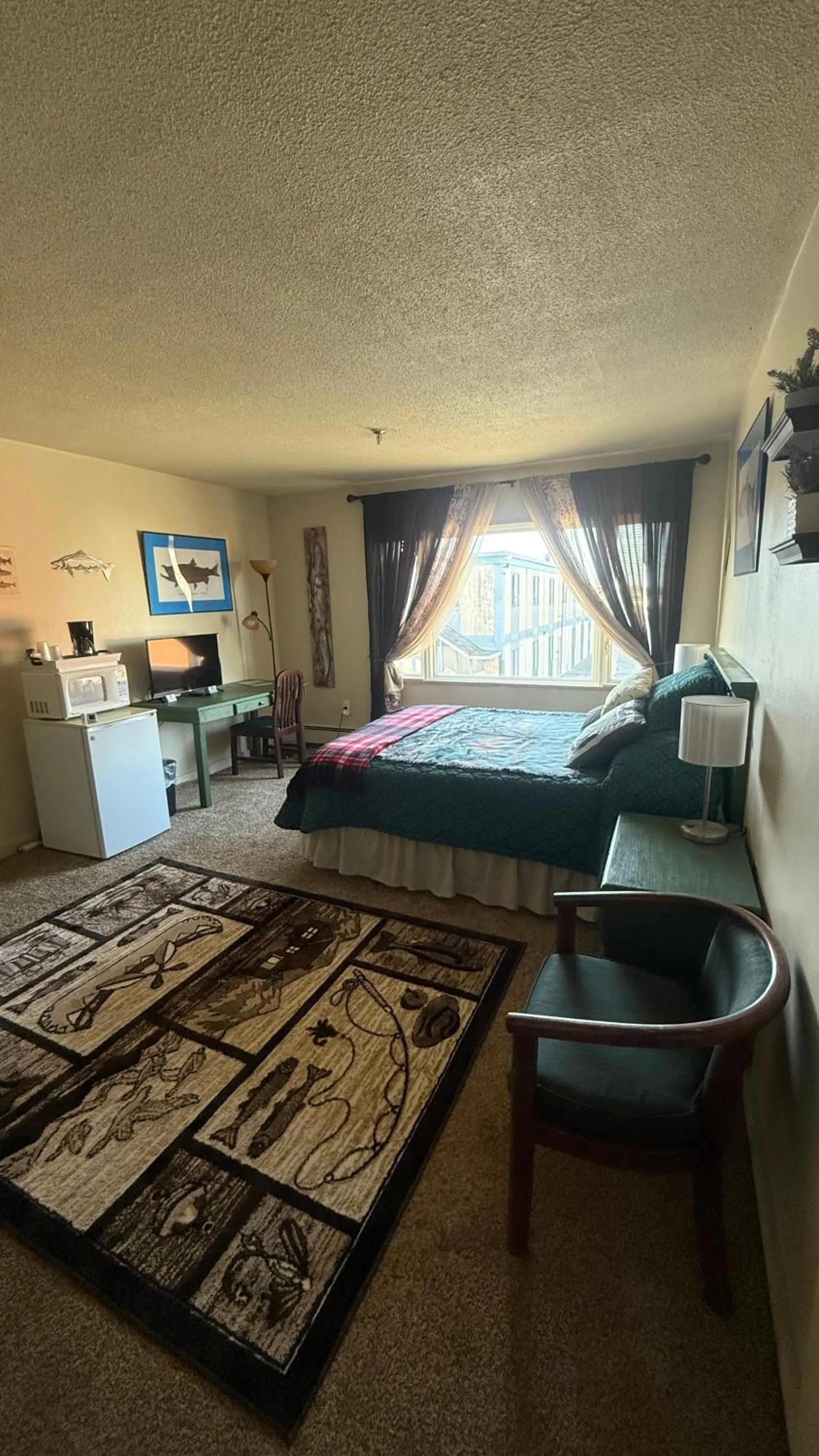 Bed in The Kenai Inn