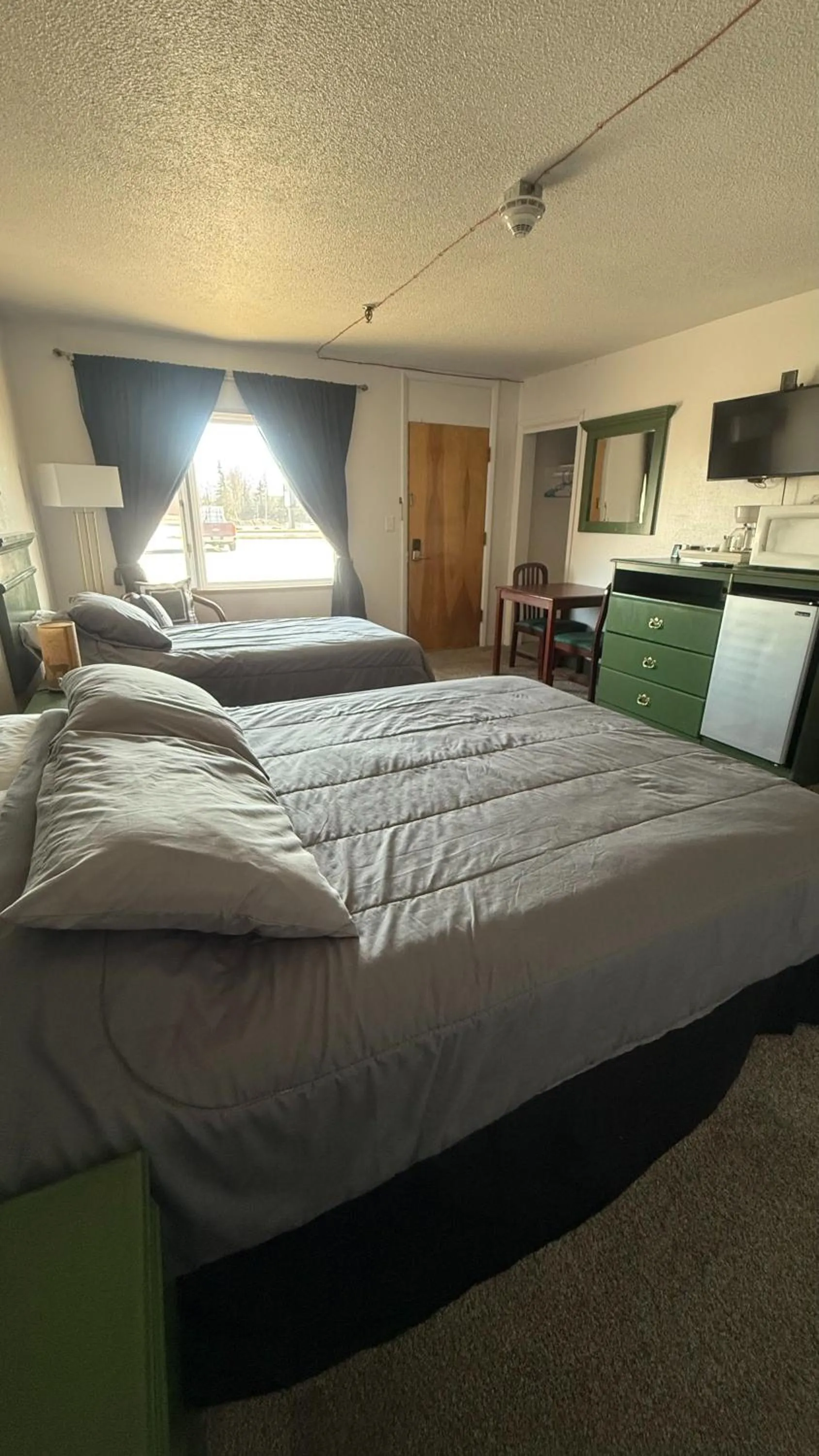 Bed in The Kenai Inn