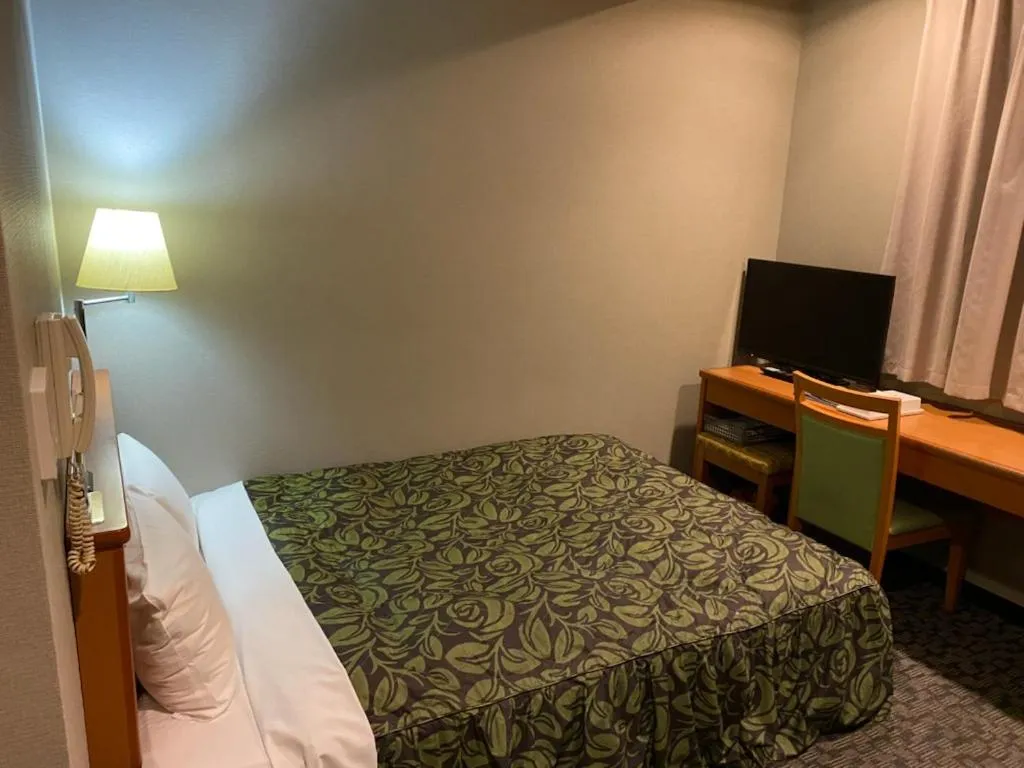 Bed in Hotel Sunrise21