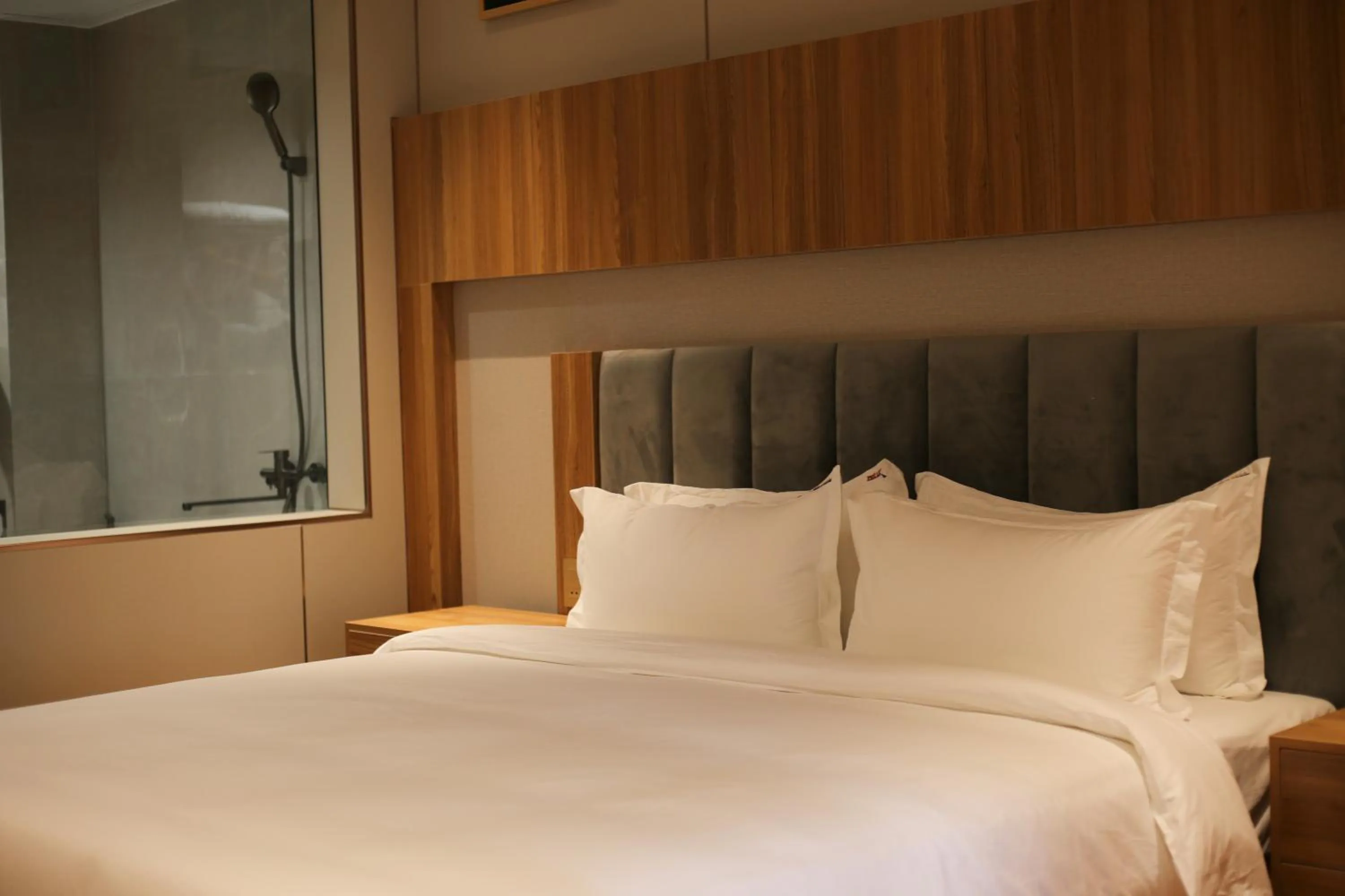 Bed in Phú Long Tam Kỳ Hotel & Restaurant