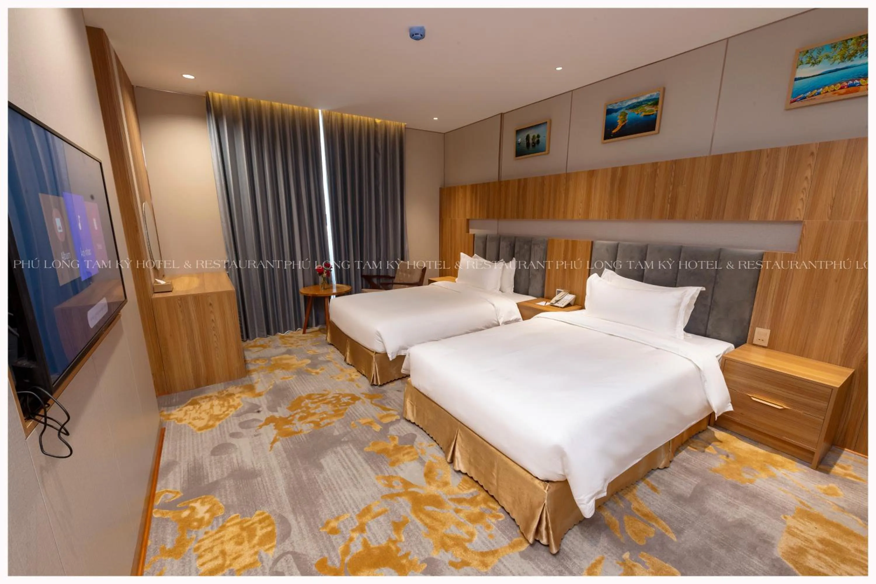 Bed in Phú Long Tam Kỳ Hotel & Restaurant