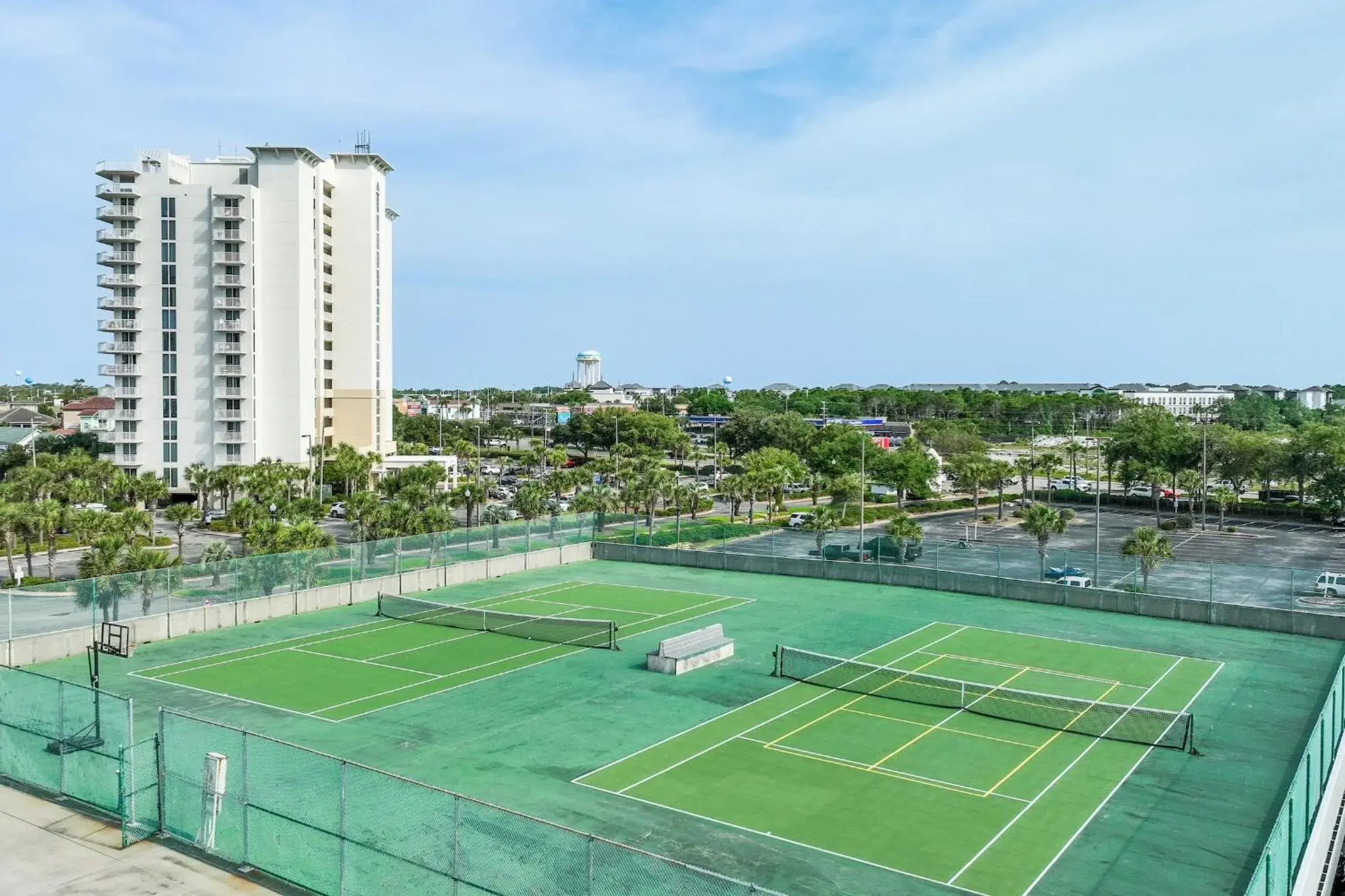 Tennis court, Swimming Pool in Pelican Beach Resort by ResortQuest