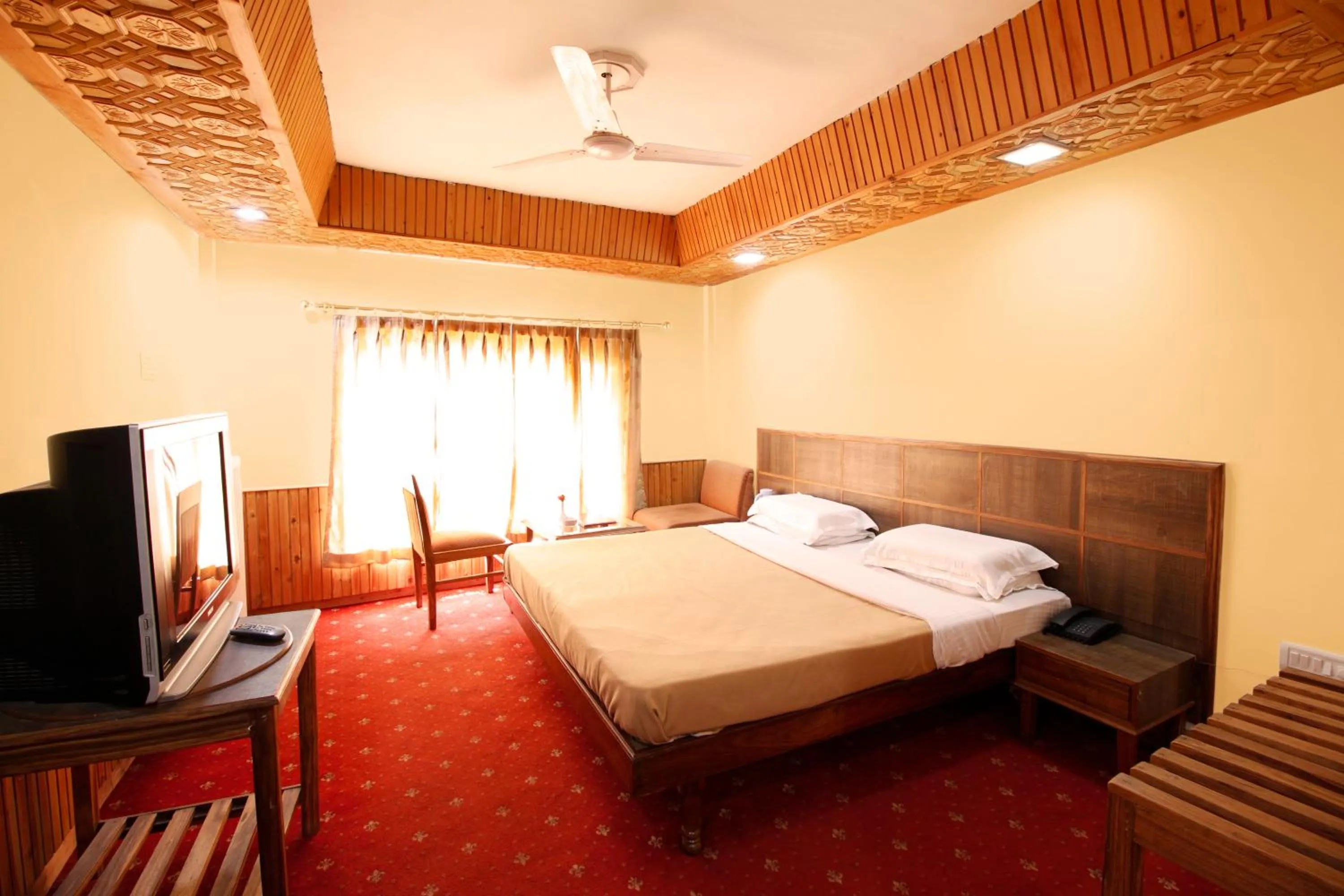 Bedroom, Bed in Vardaan Hotels - PatniTop