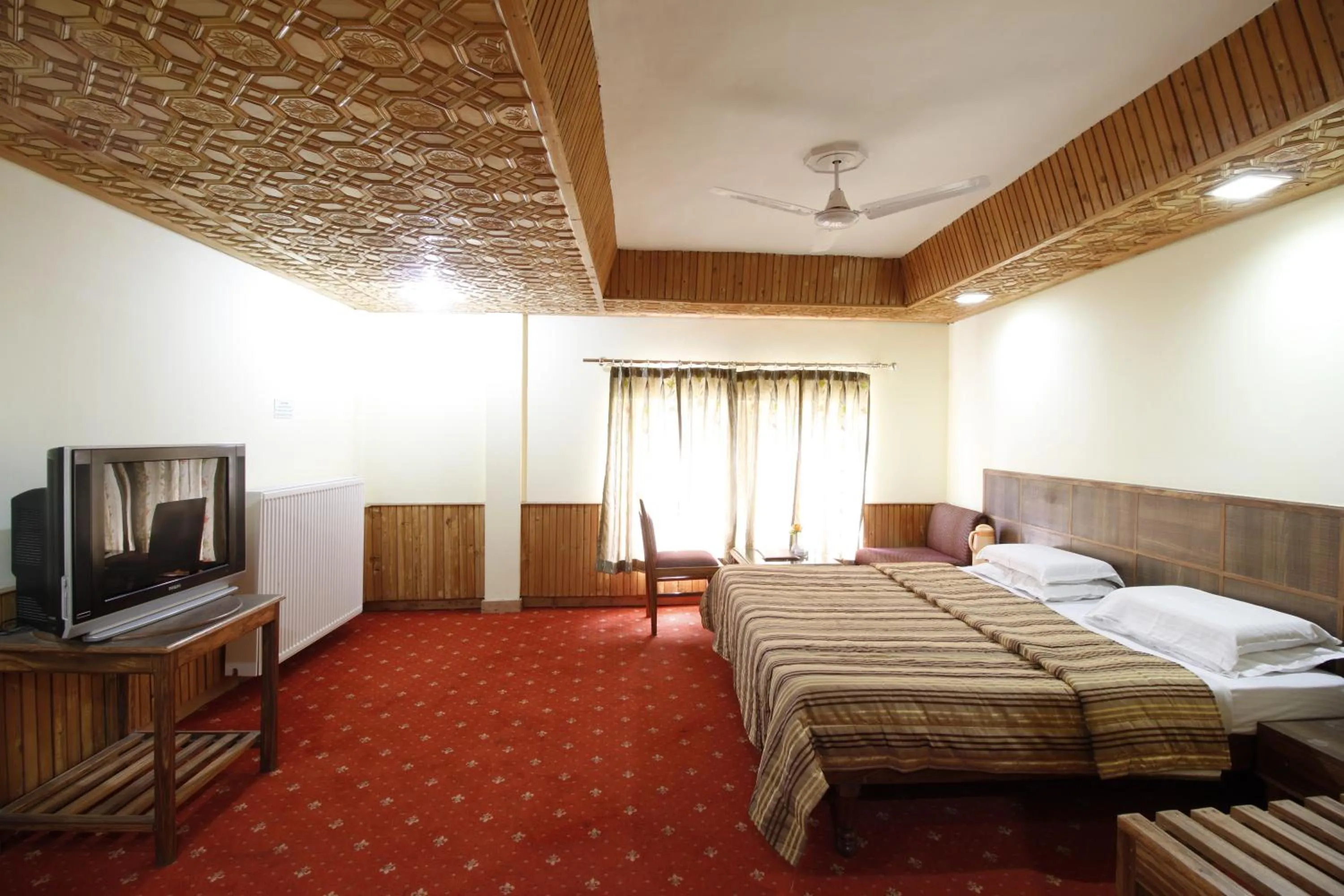 Bedroom, Bed in Vardaan Hotels - PatniTop