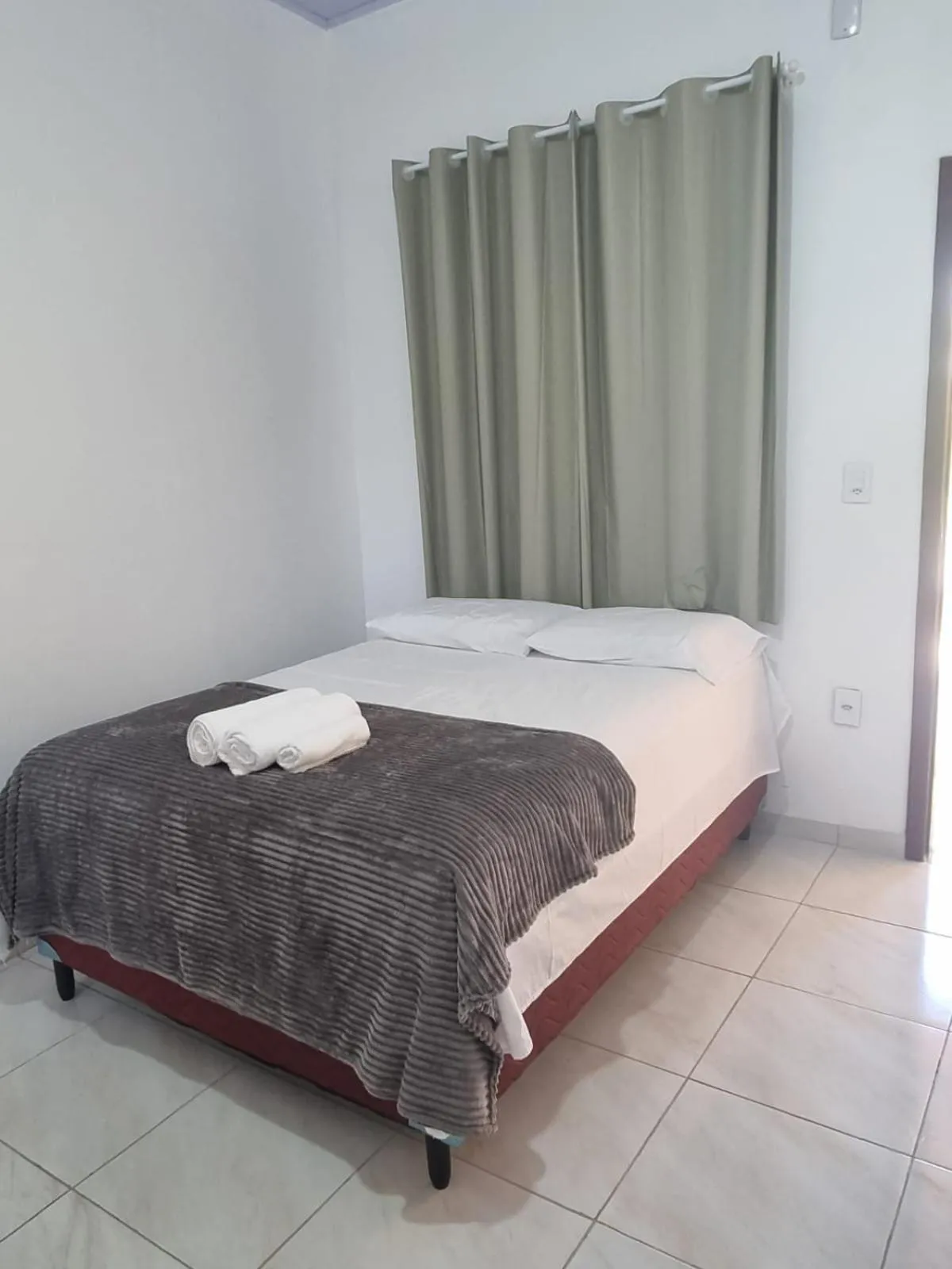 Bed in Pousada Talismã