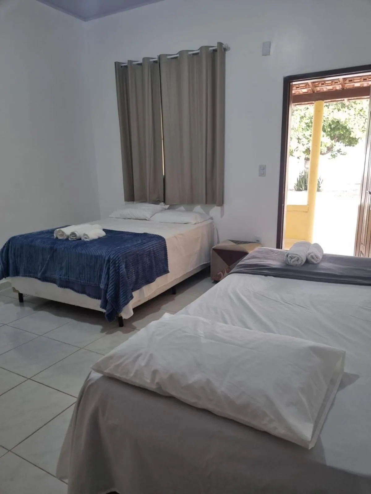 Bed in Pousada Talismã