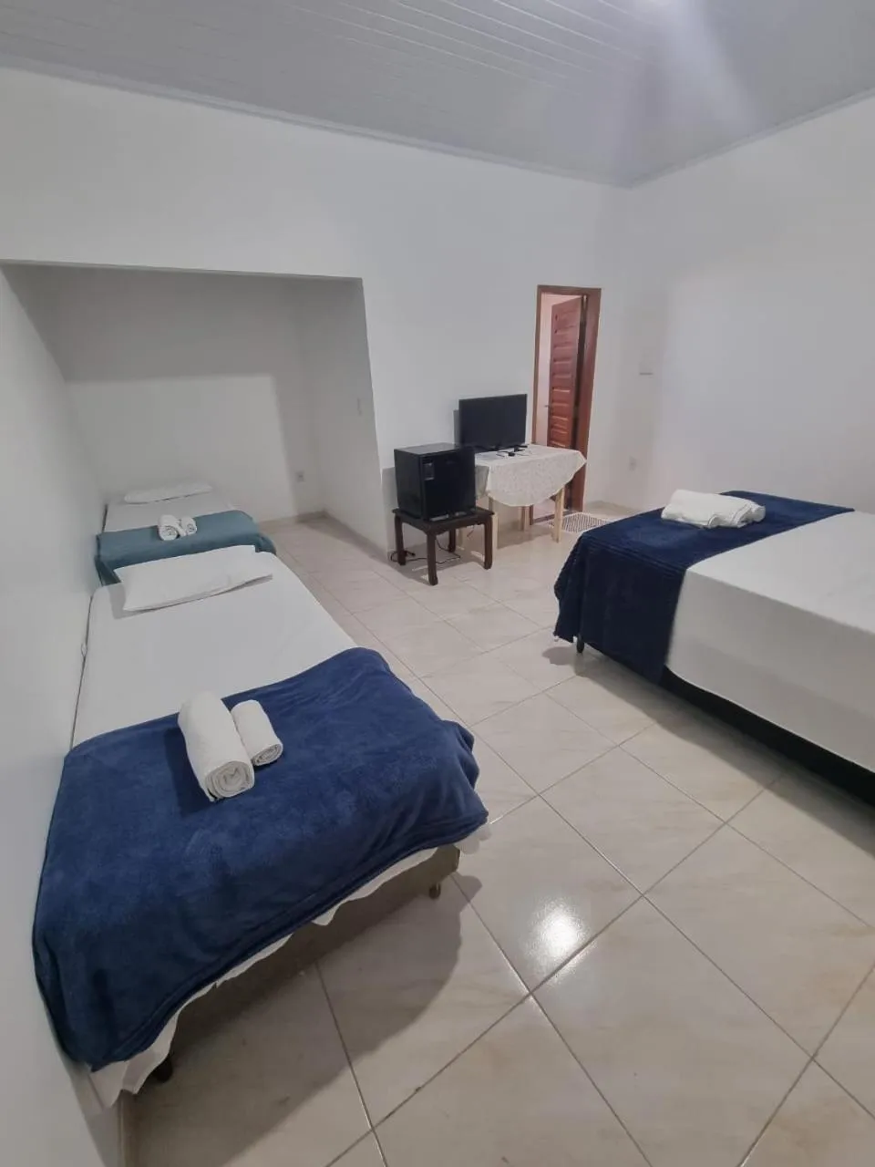 Bed in Pousada Talismã