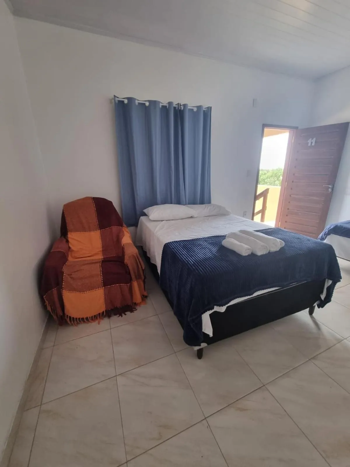 Bed in Pousada Talismã