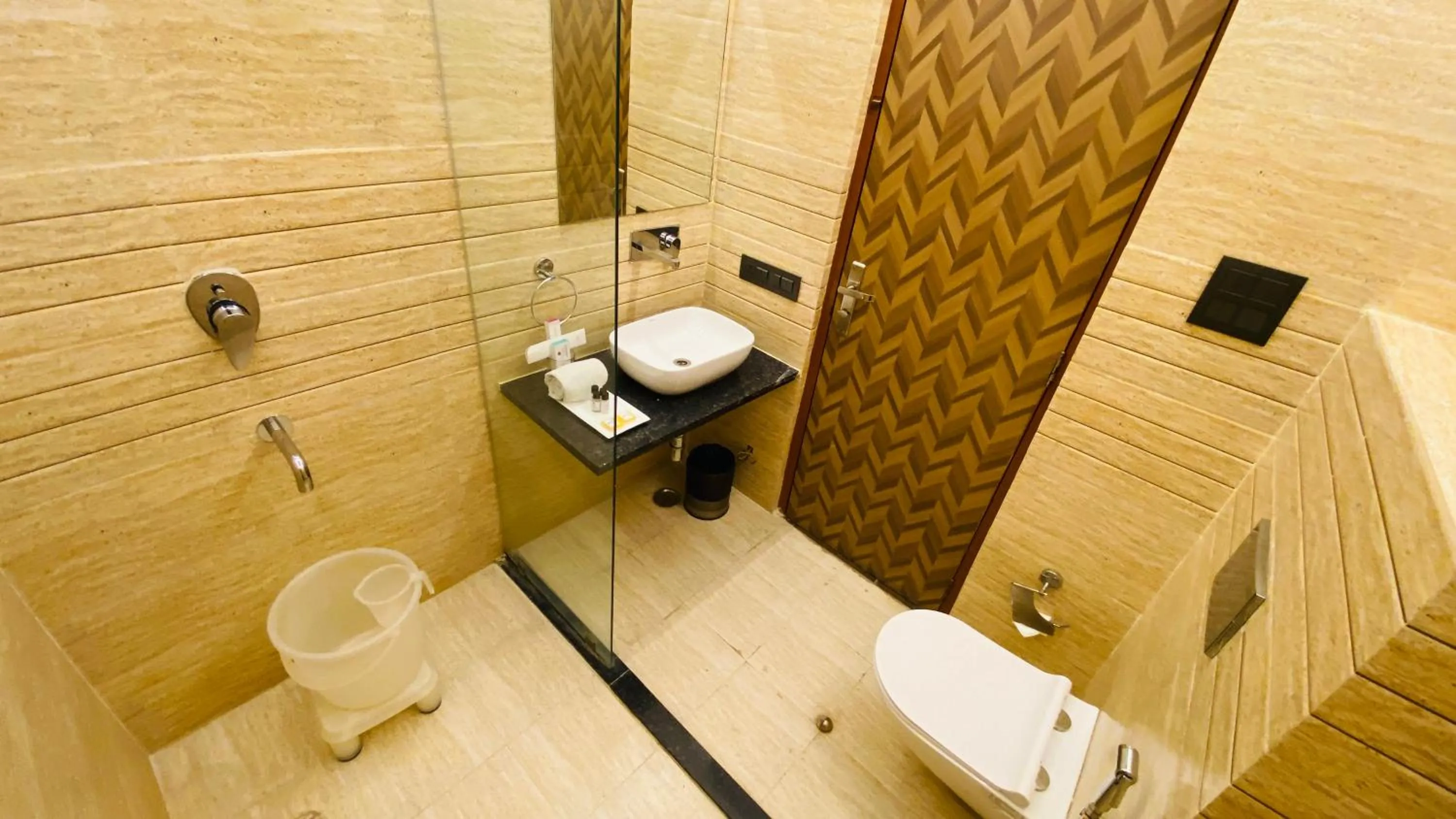 Shower in The Byke Grassfield Resort with Outdoor Pool, Shyam Nagar, Jaipur