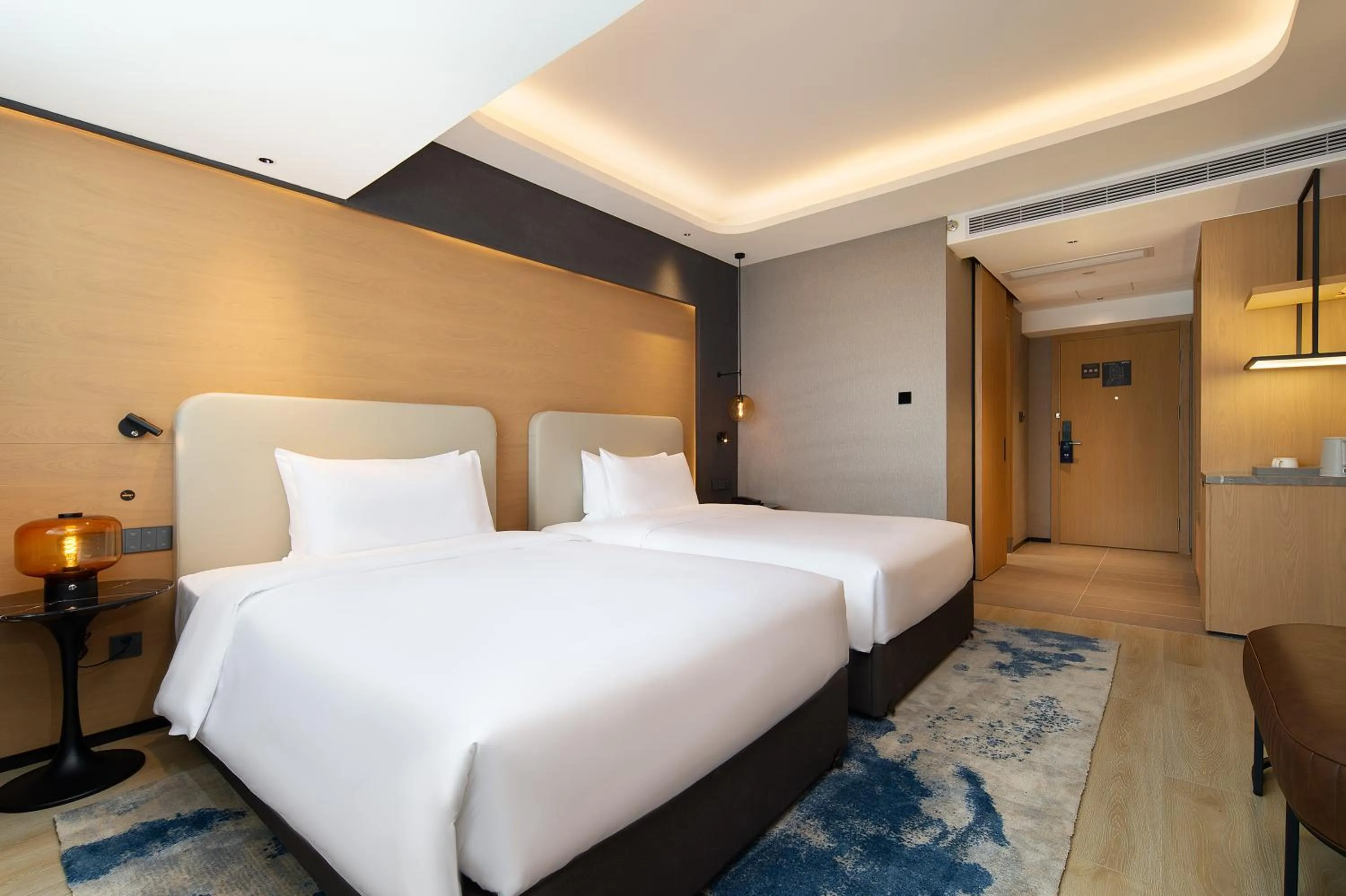 Photo of the whole room, Bed in Langham Honor International Hotel Canton Fair Complex Branch - Free Shuttle to Canton Fair Complex During Canton Fair Period & Free Mini Bar