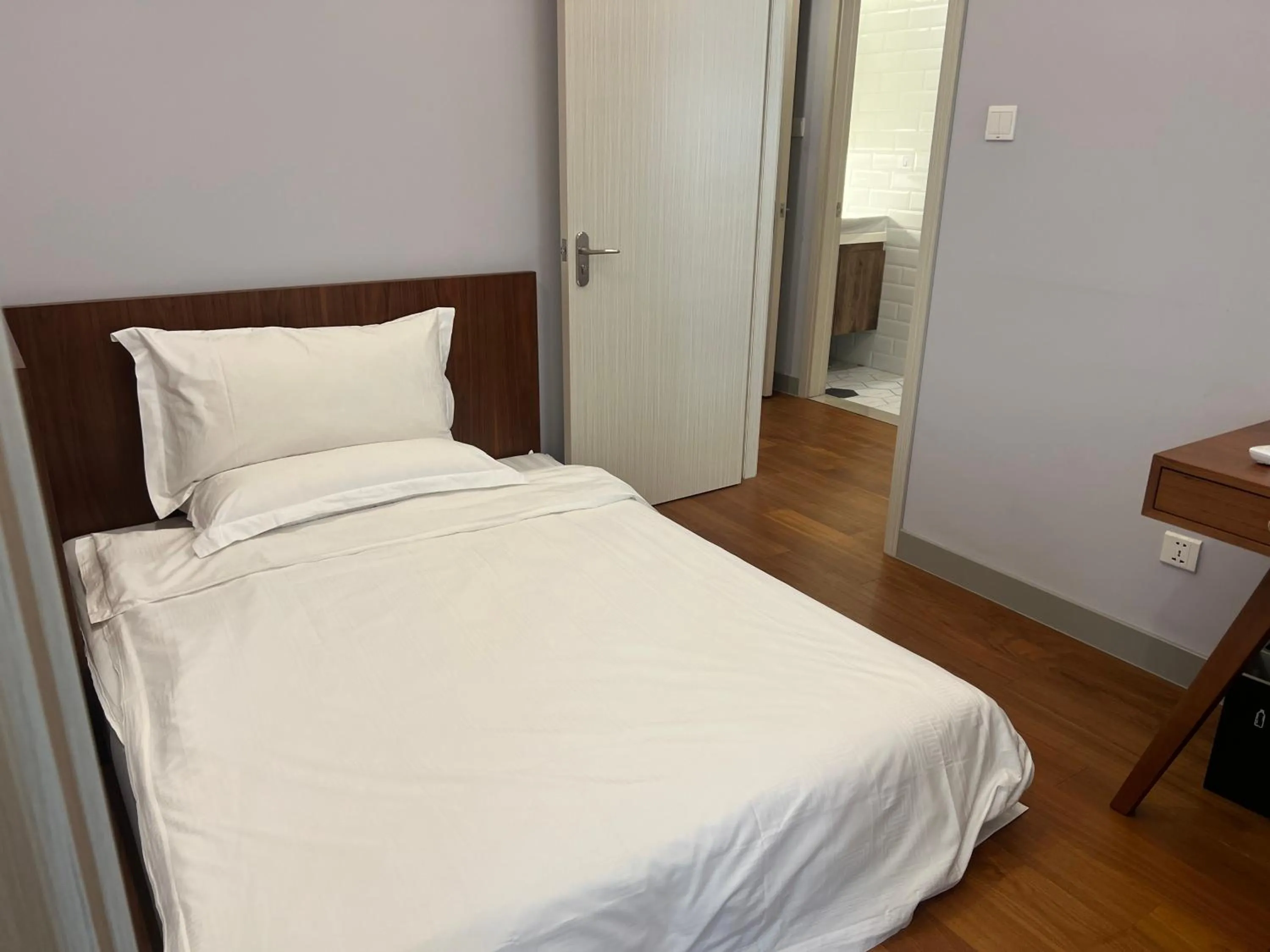 Bed in Guangyao Service Apartment Beijing Ritan