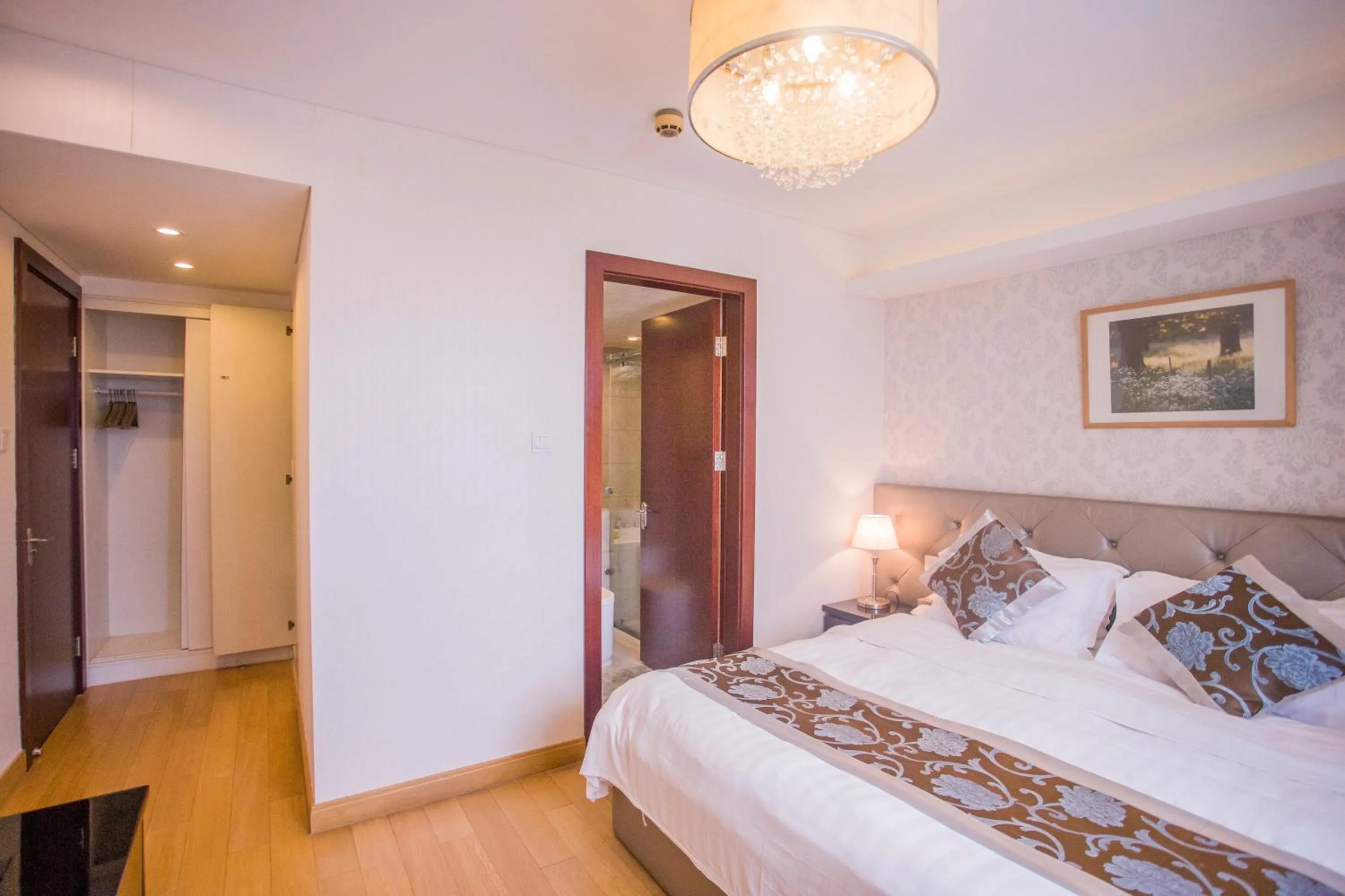 Bed in Guangyao Service Apartment Beijing Ritan