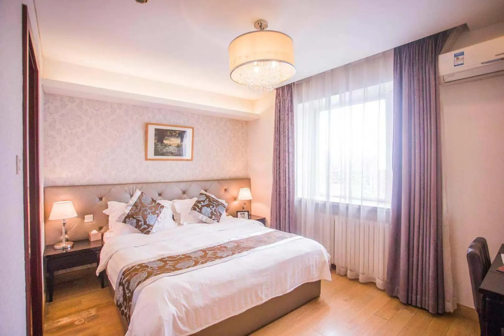 Bed in Guangyao Service Apartment Beijing Ritan