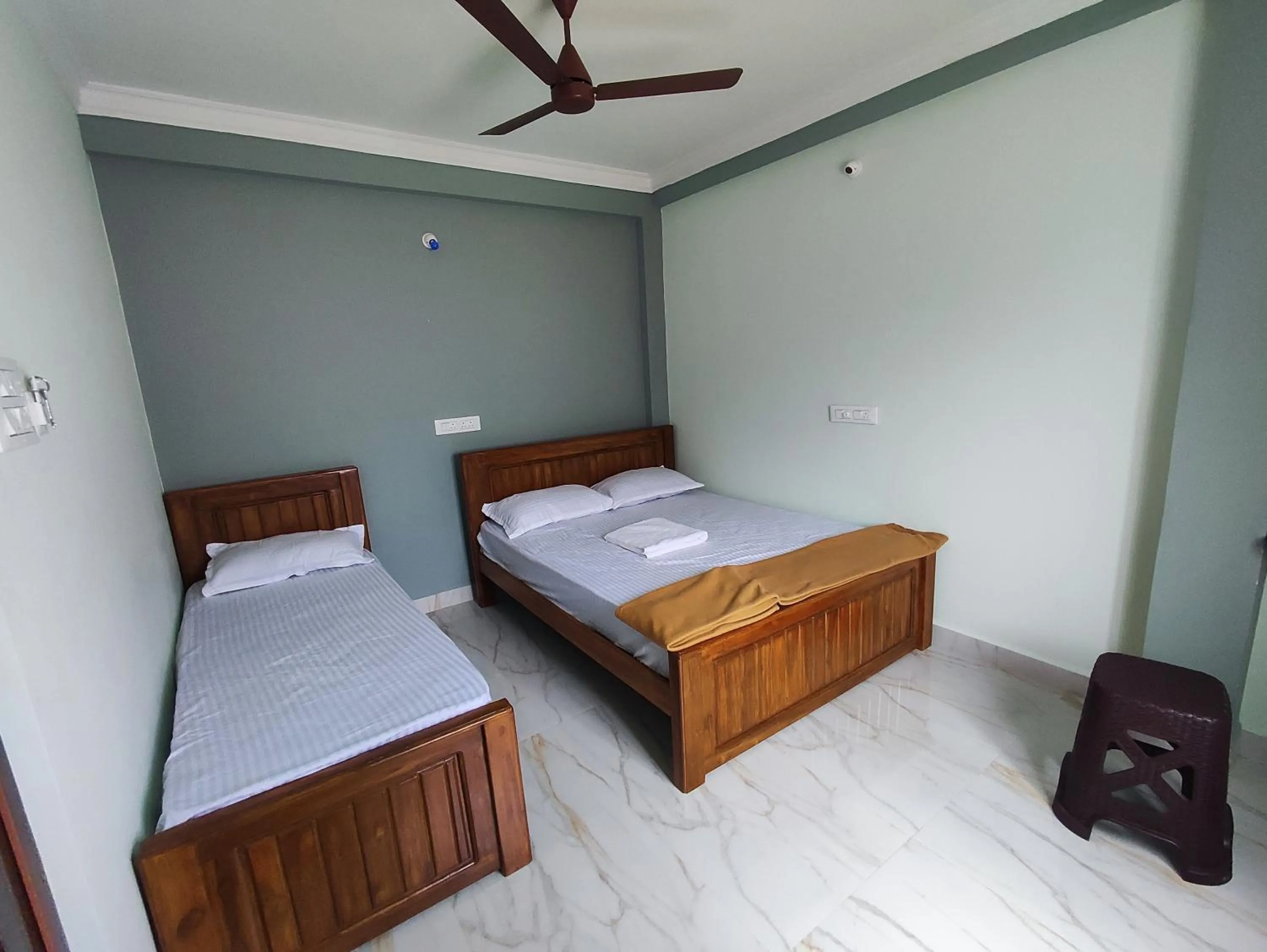 Bed in Sri Aksha Residency