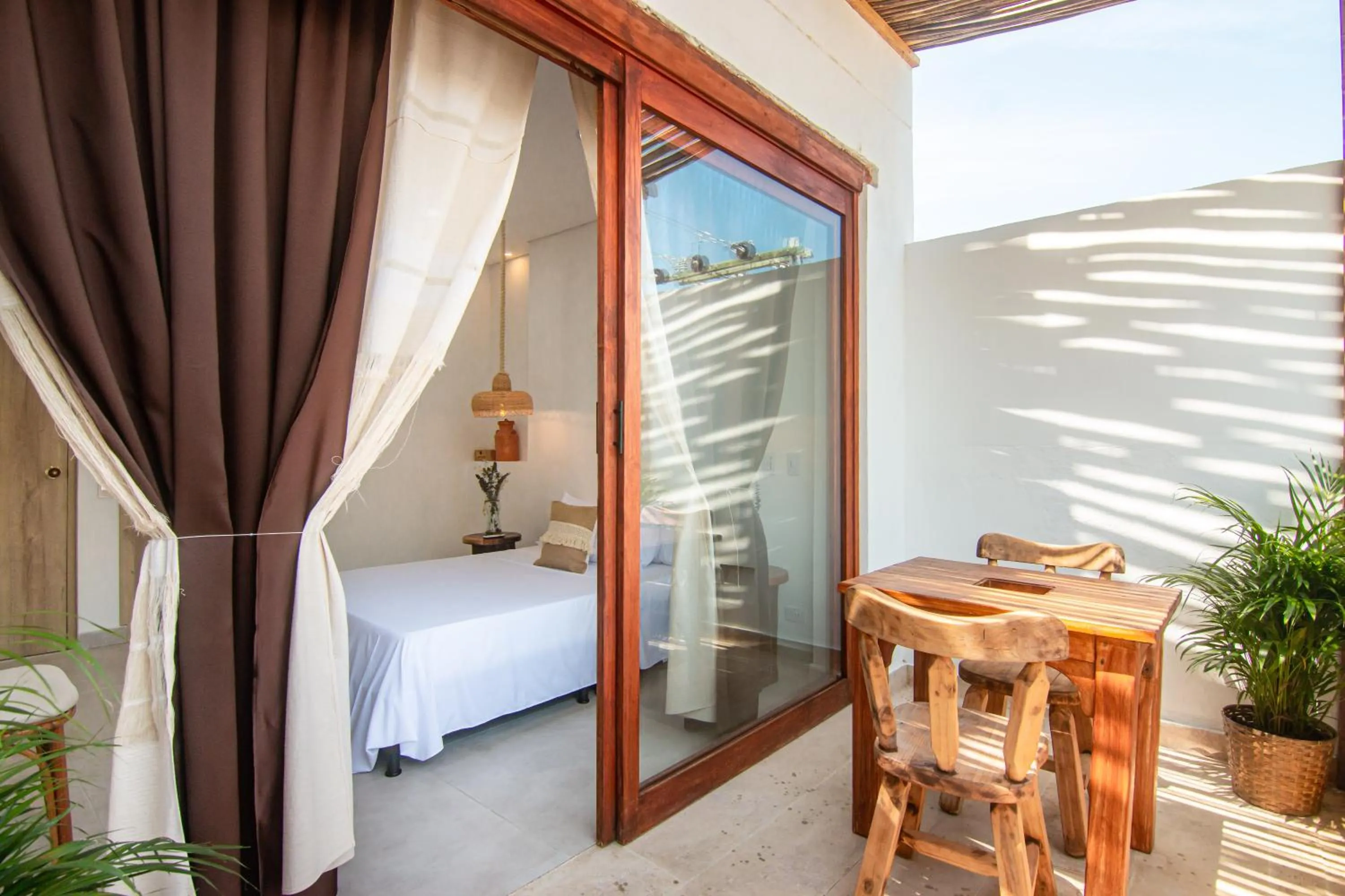 Balcony/Terrace, Bed in Hotel Boutique de playa - Casa Solhu
