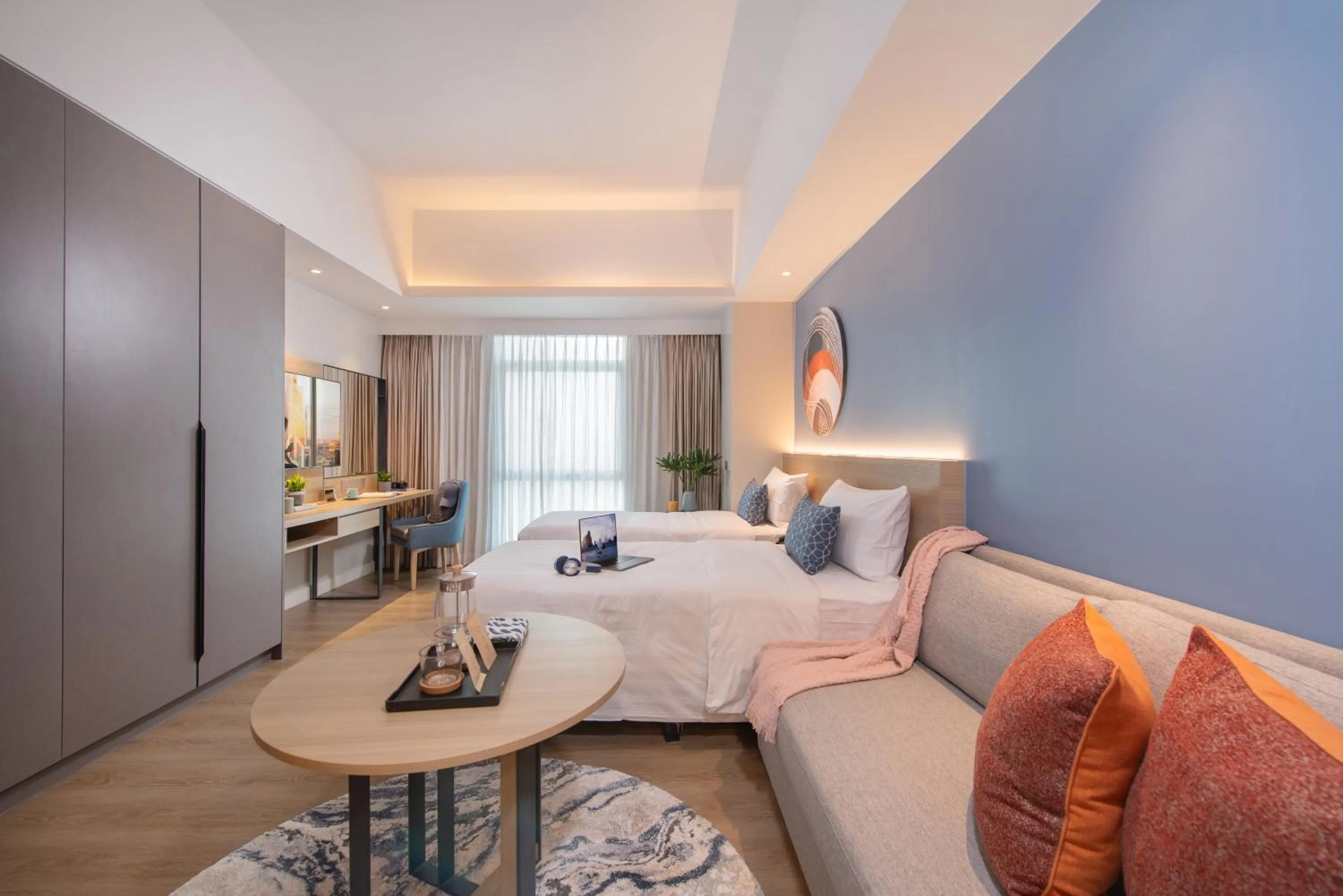 Seating area, Bed in Citadines Roces Quezon City