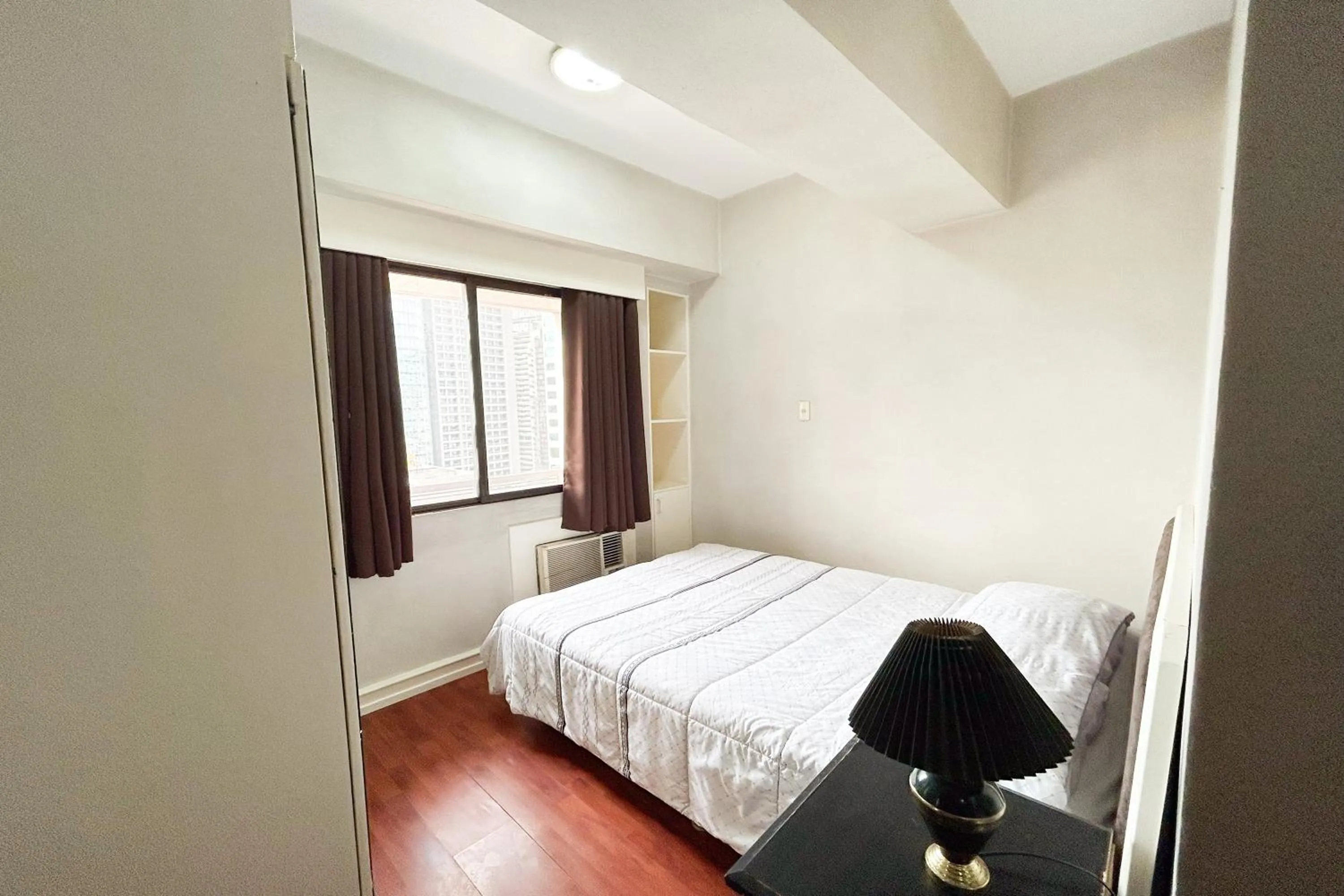 Bed in Sunette Tower Suites Makati City Center