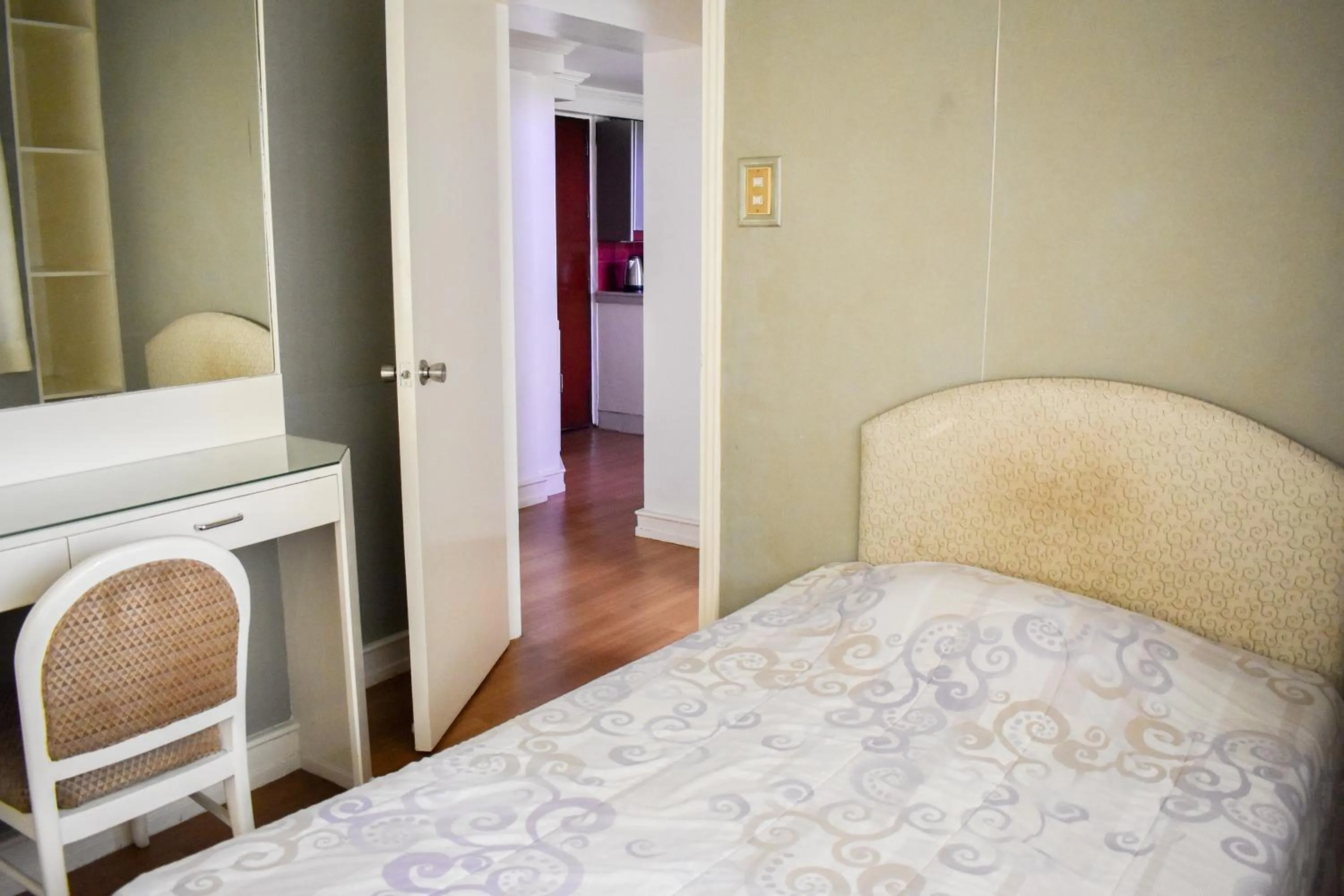 Bed in Sunette Tower Suites Makati City Center