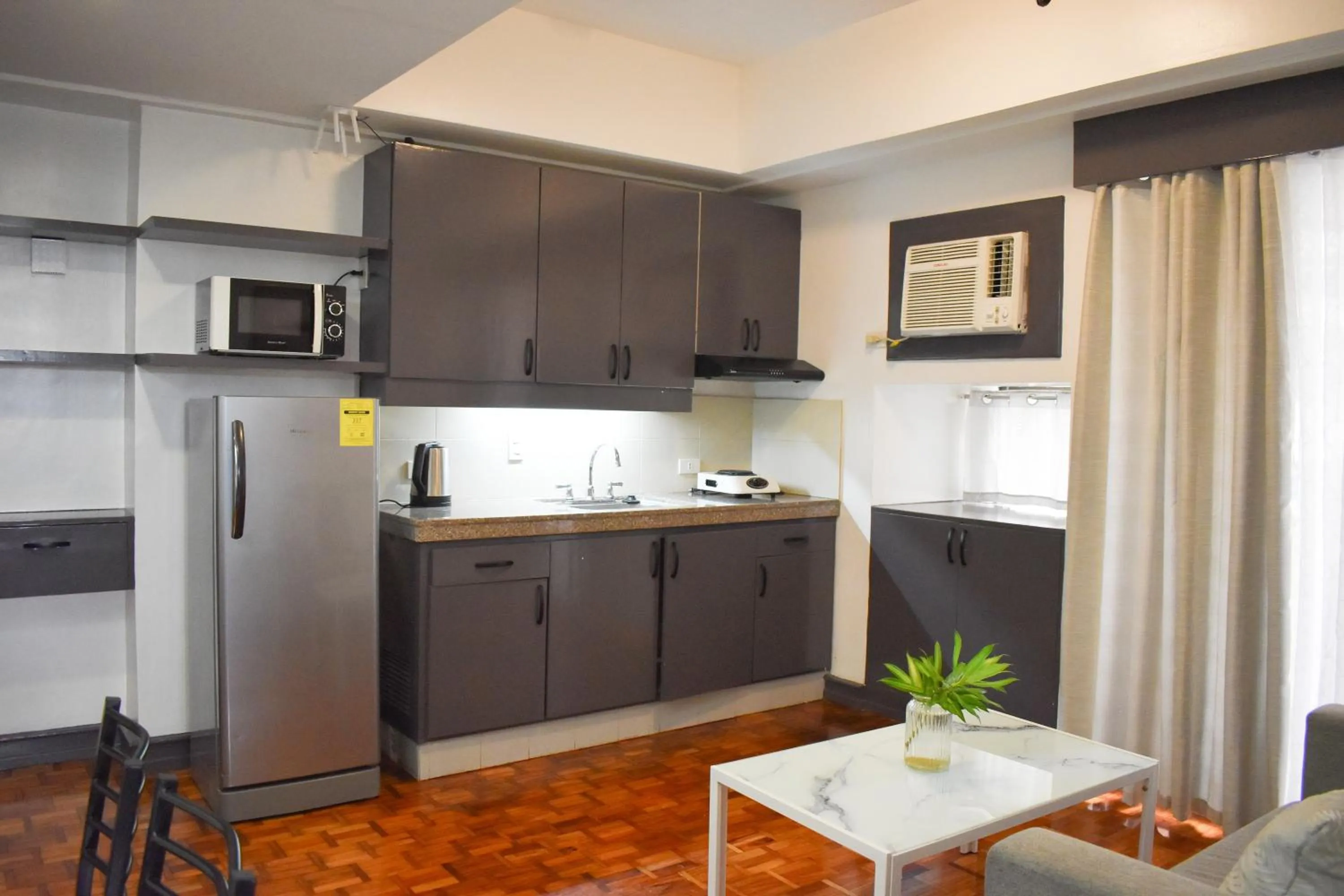 Kitchen or kitchenette in Sunette Tower Suites Makati City Center