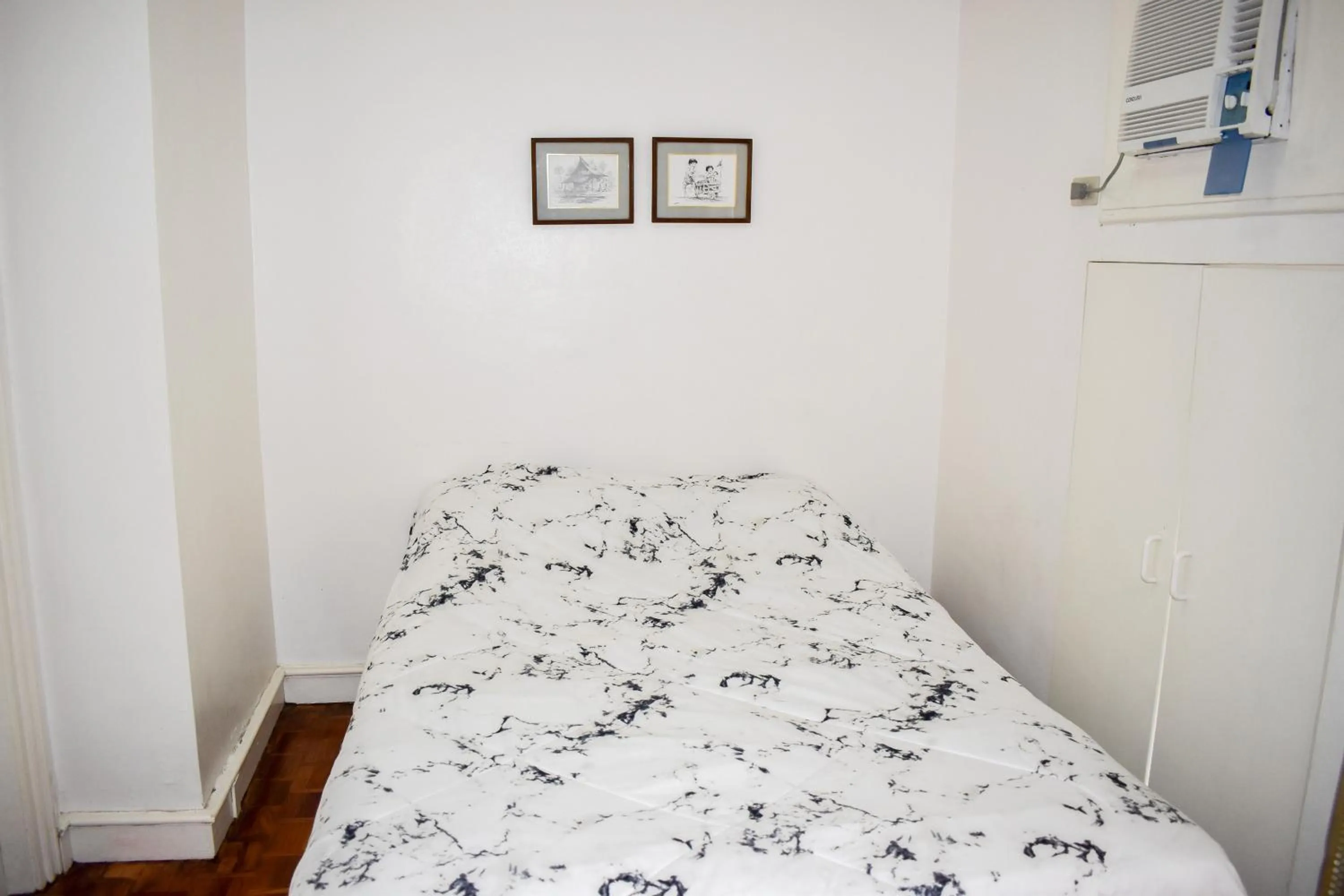 Bed in Sunette Tower Suites Makati City Center