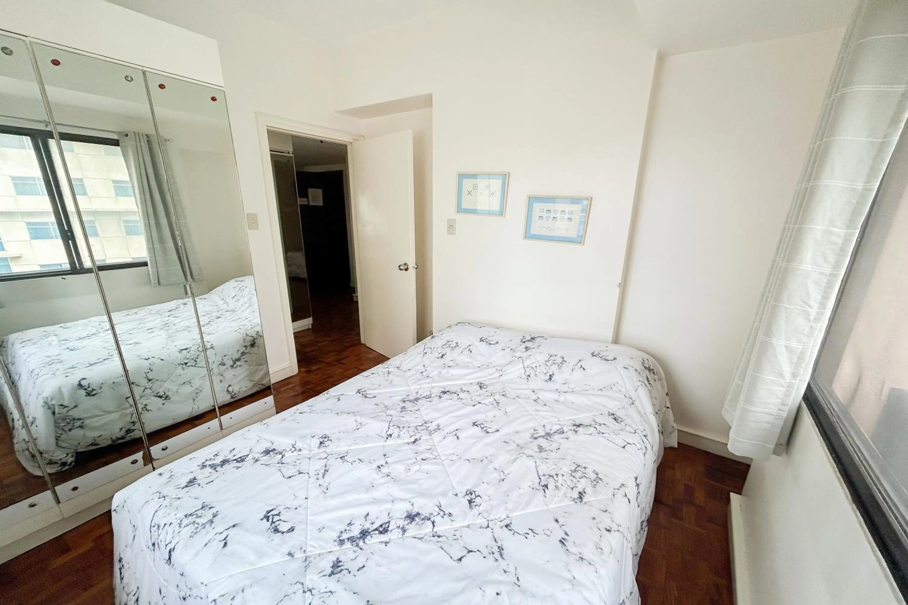 Bed in Sunette Tower Suites Makati City Center