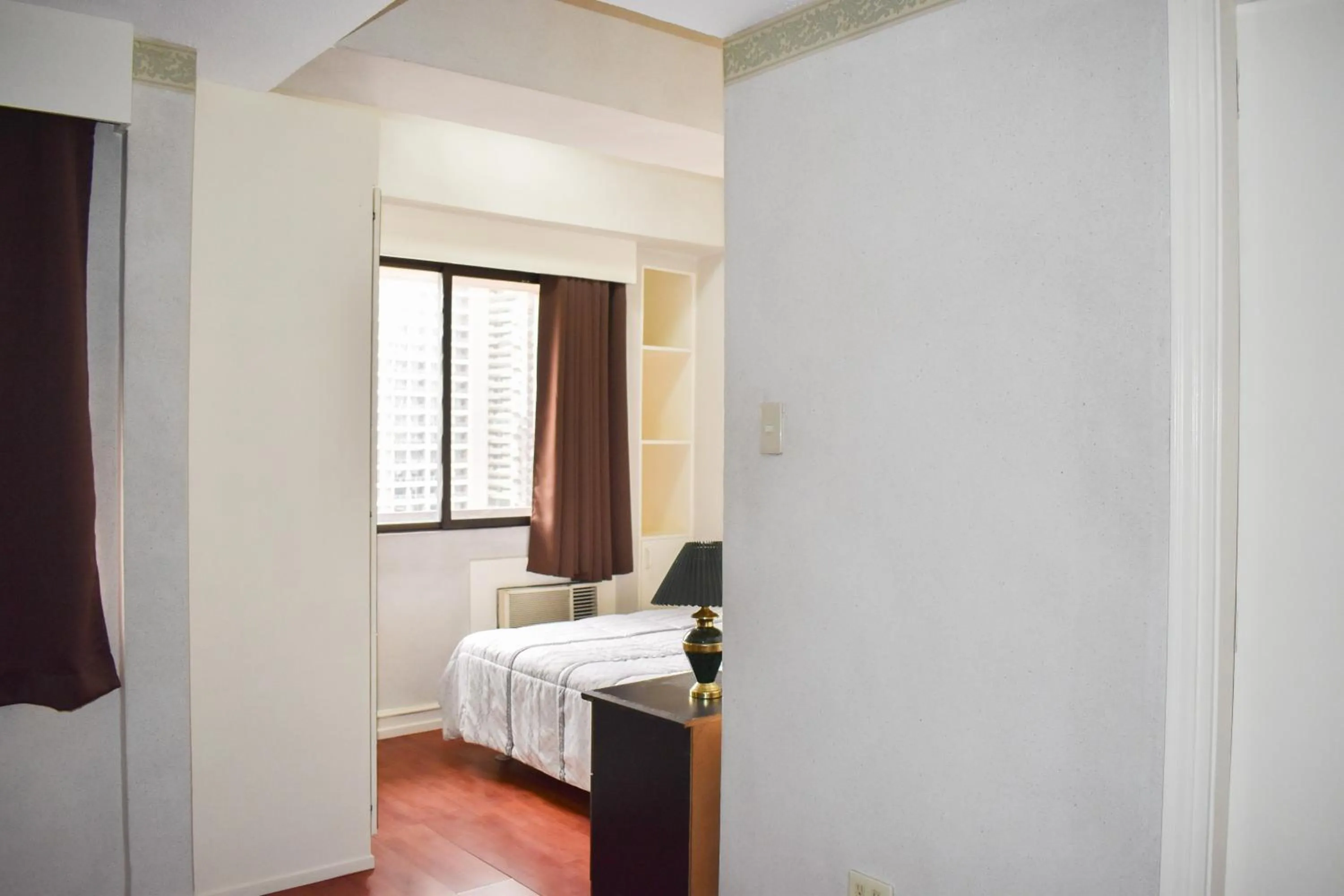 Bed in Sunette Tower Suites Makati City Center