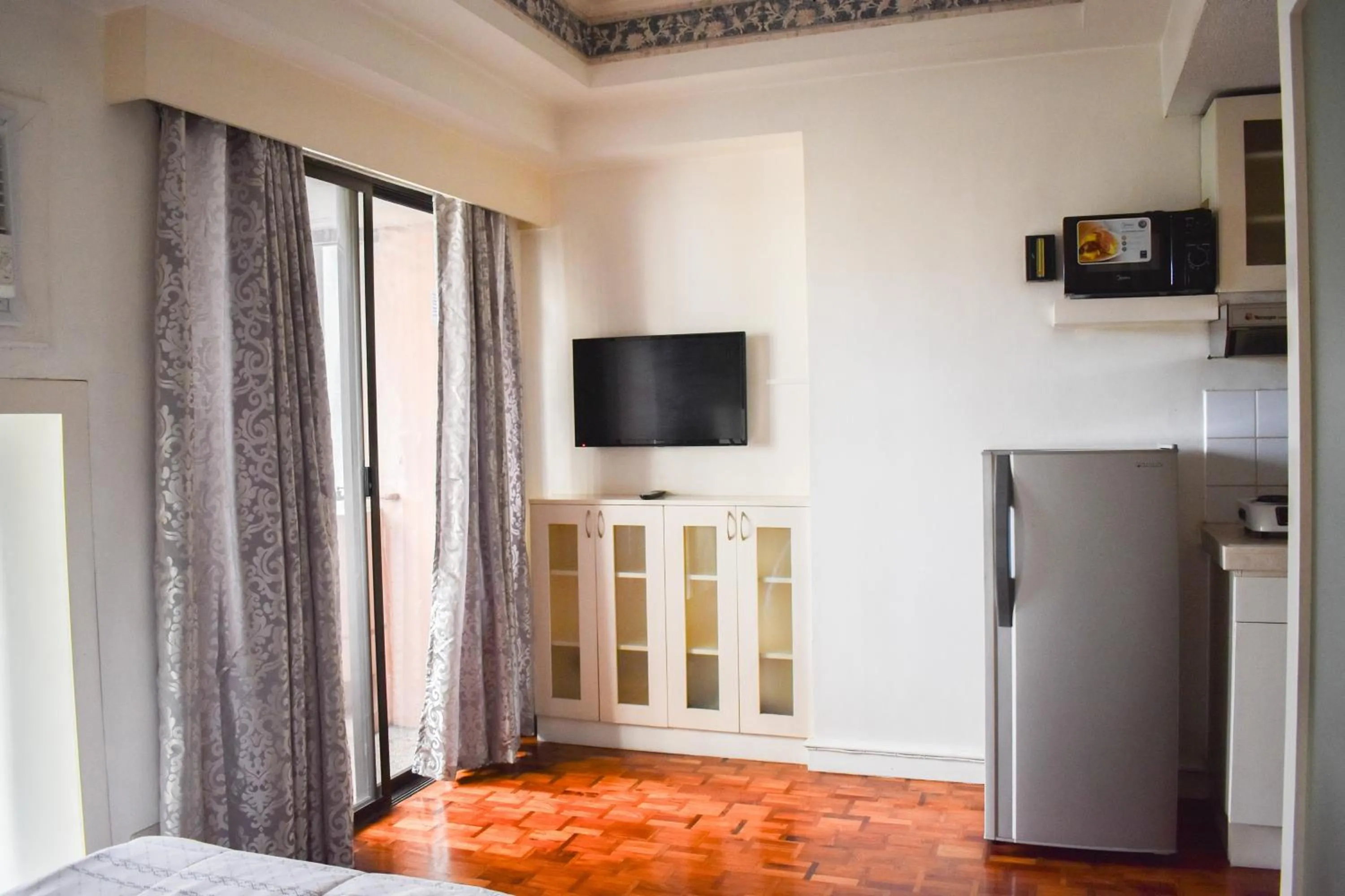 Bed in Sunette Tower Suites Makati City Center