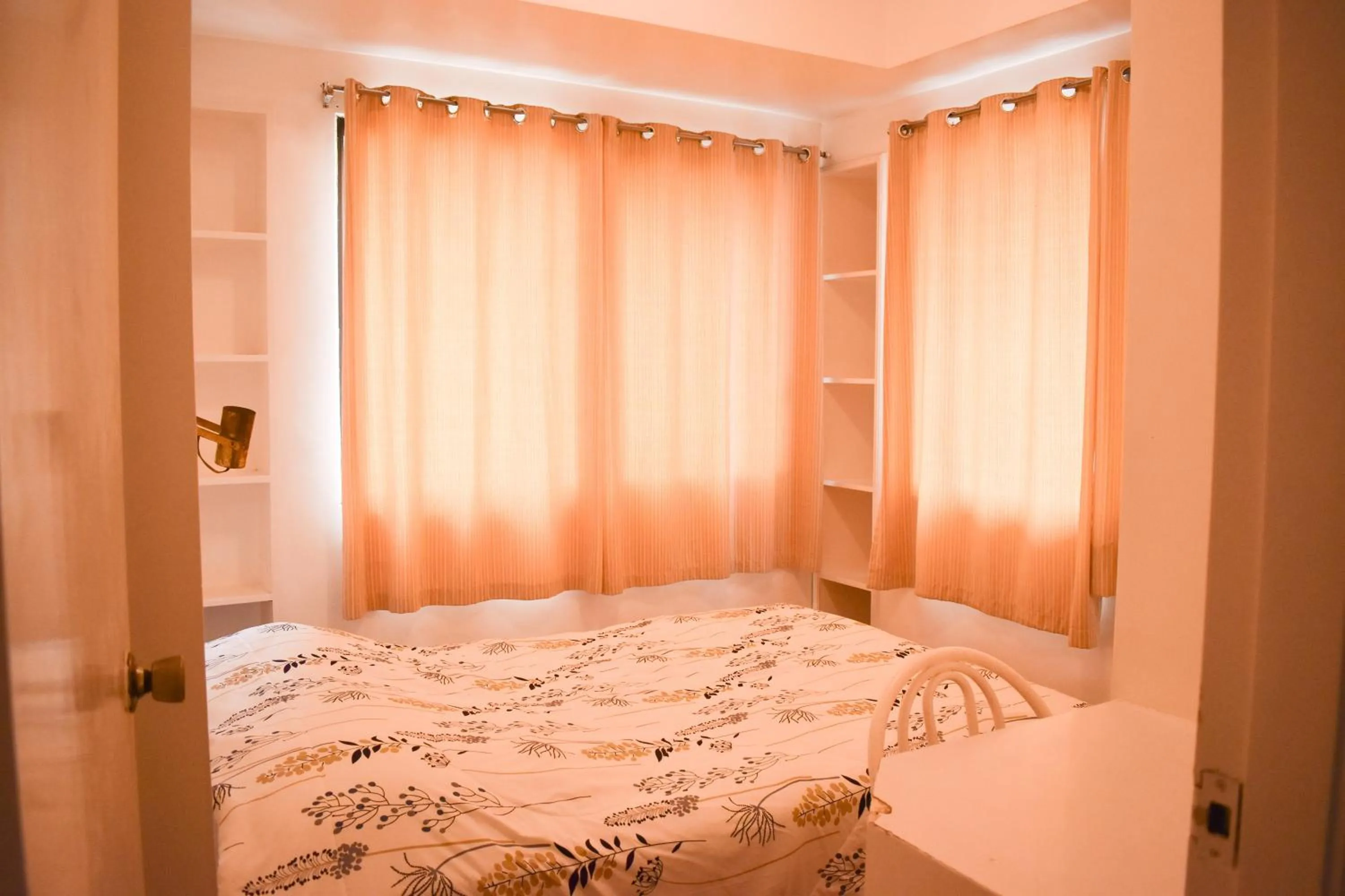 Bed in Sunette Tower Suites Makati City Center