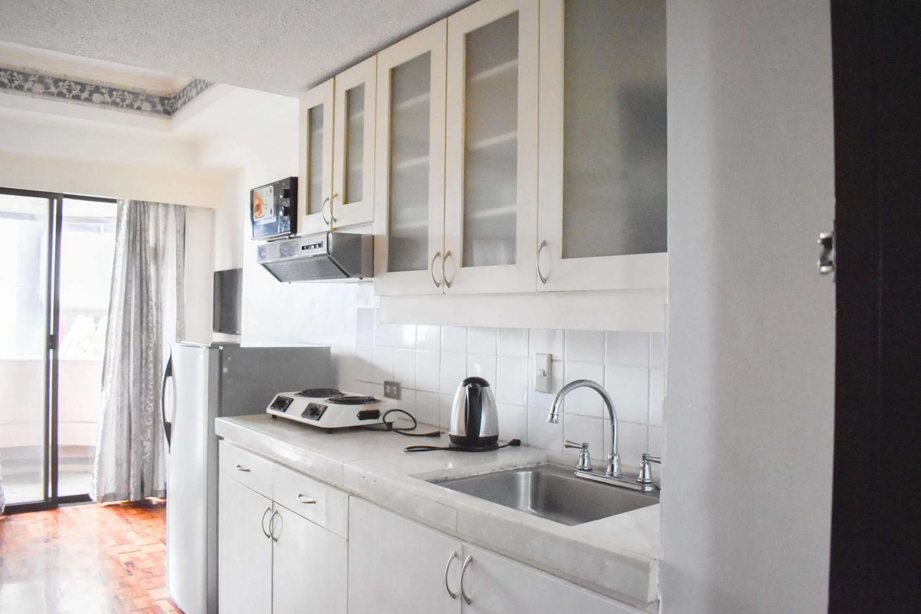 Kitchen or kitchenette in Sunette Tower Suites Makati City Center