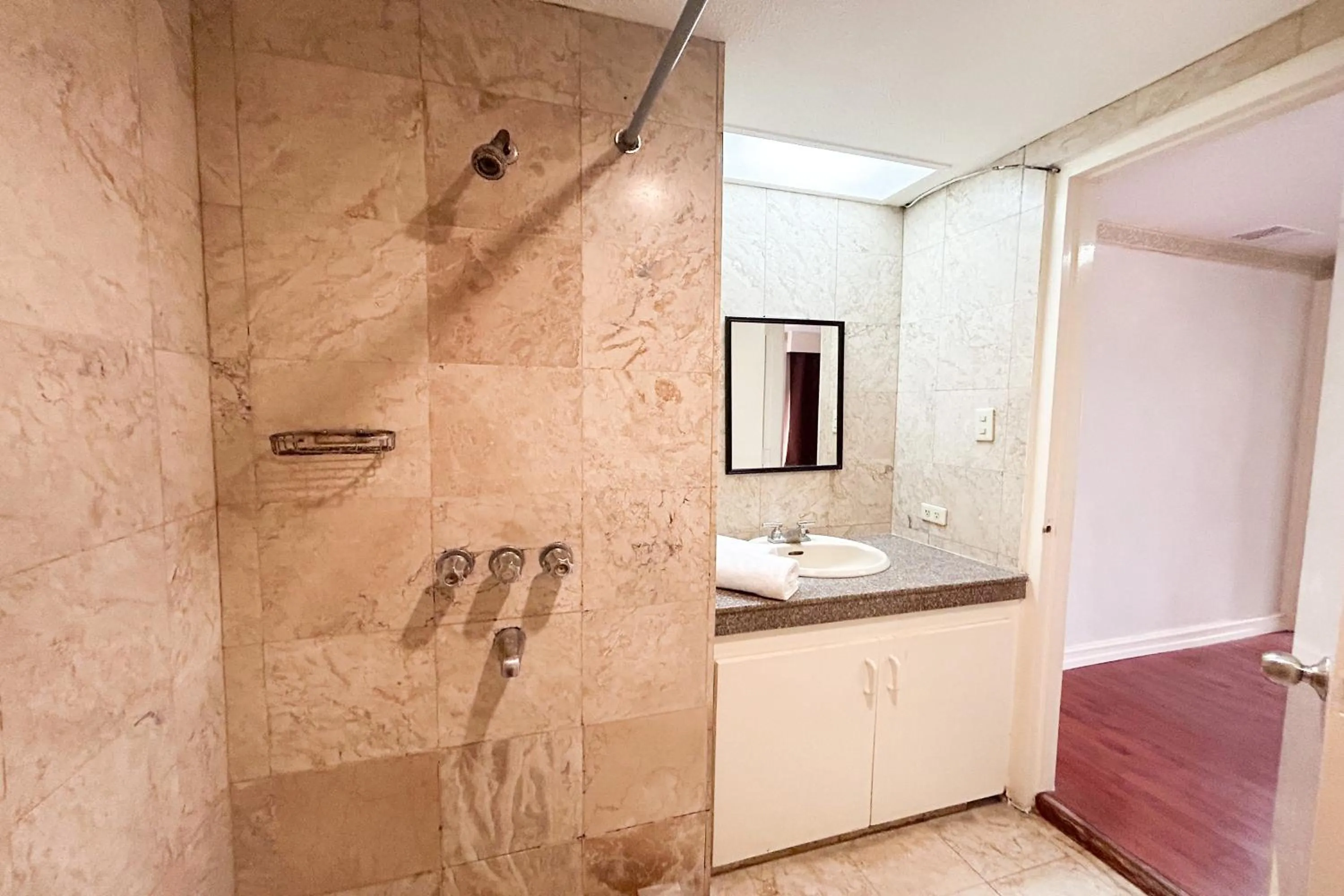 Shower in Sunette Tower Suites Makati City Center