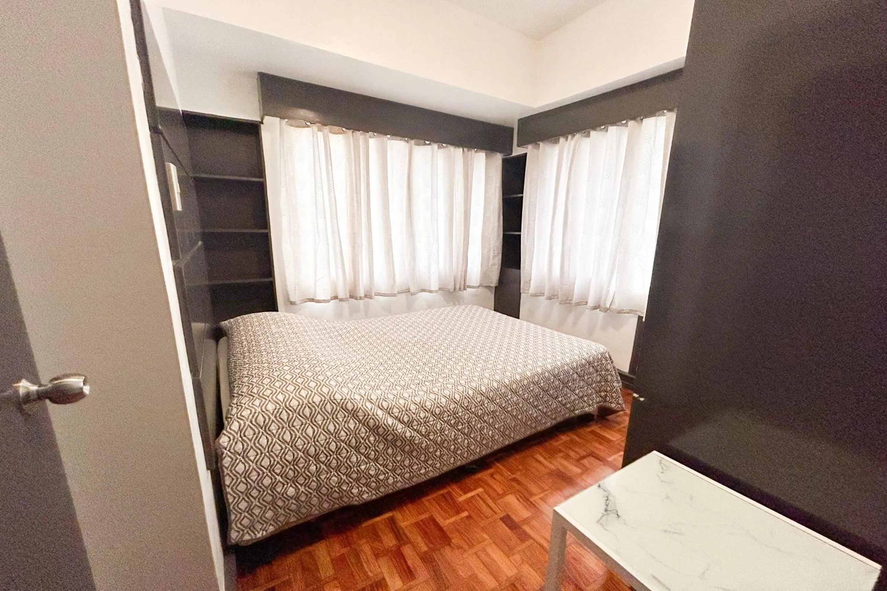 Bed in Sunette Tower Suites Makati City Center