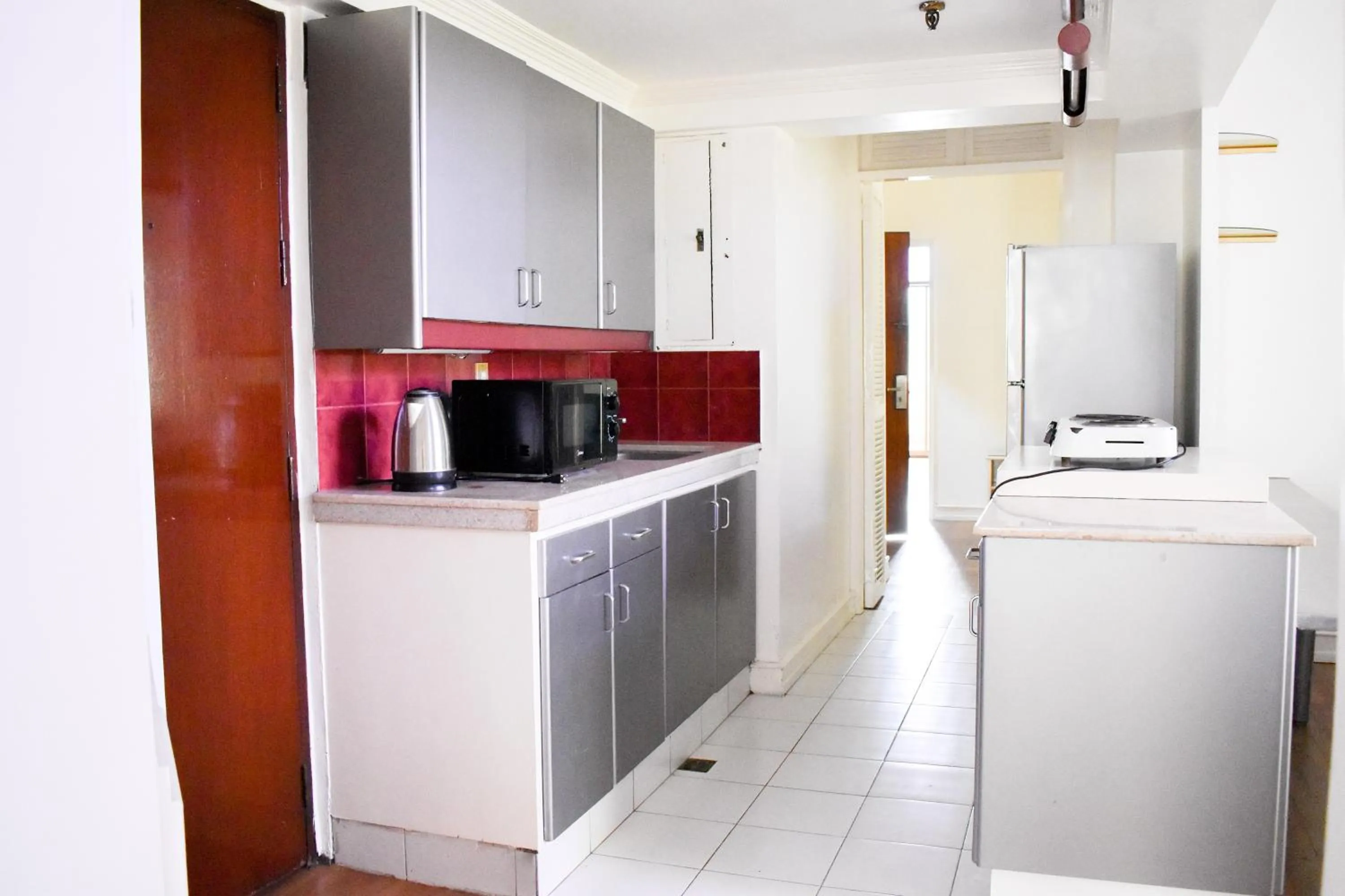 Kitchen or kitchenette in Sunette Tower Suites Makati City Center