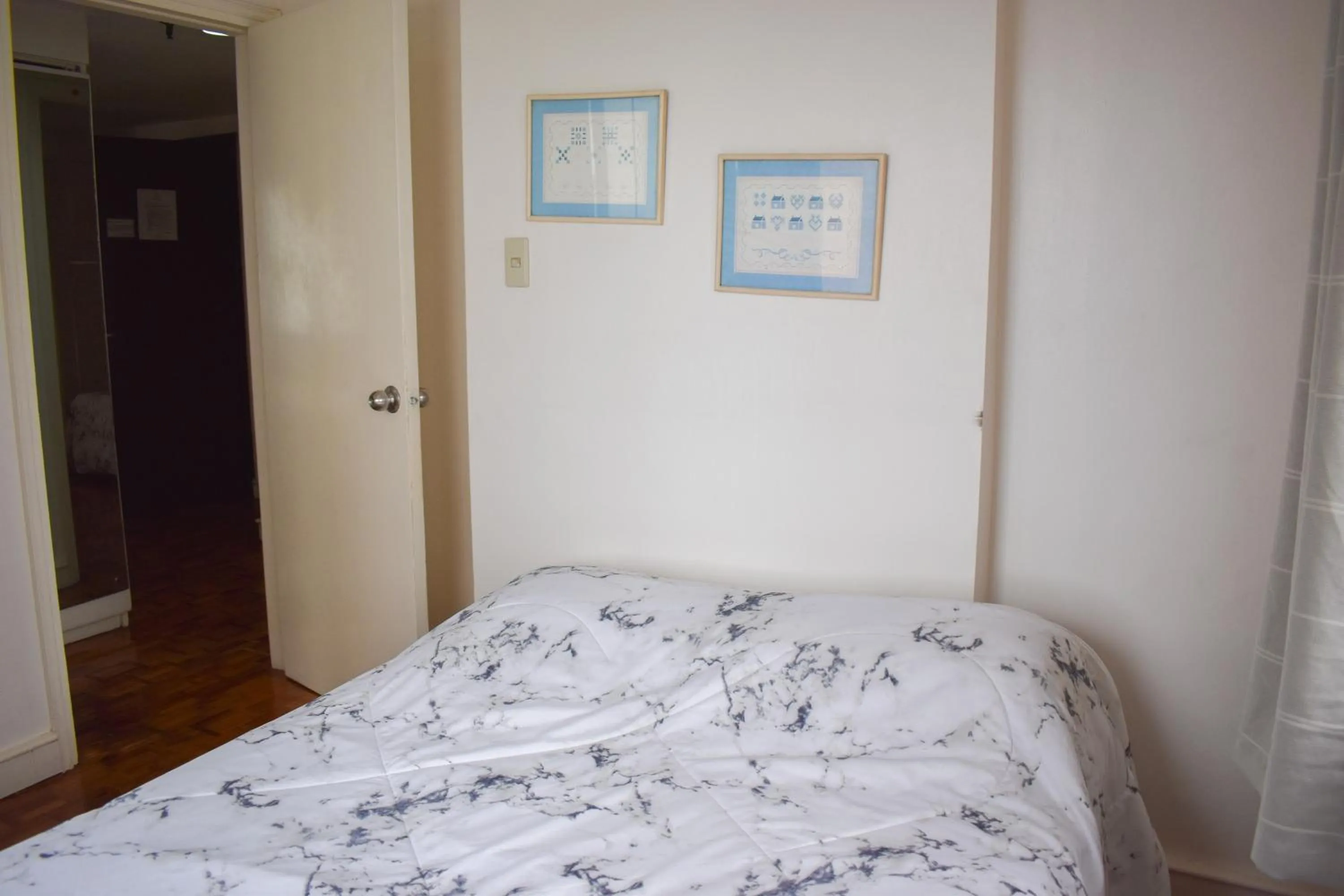 Bed in Sunette Tower Suites Makati City Center